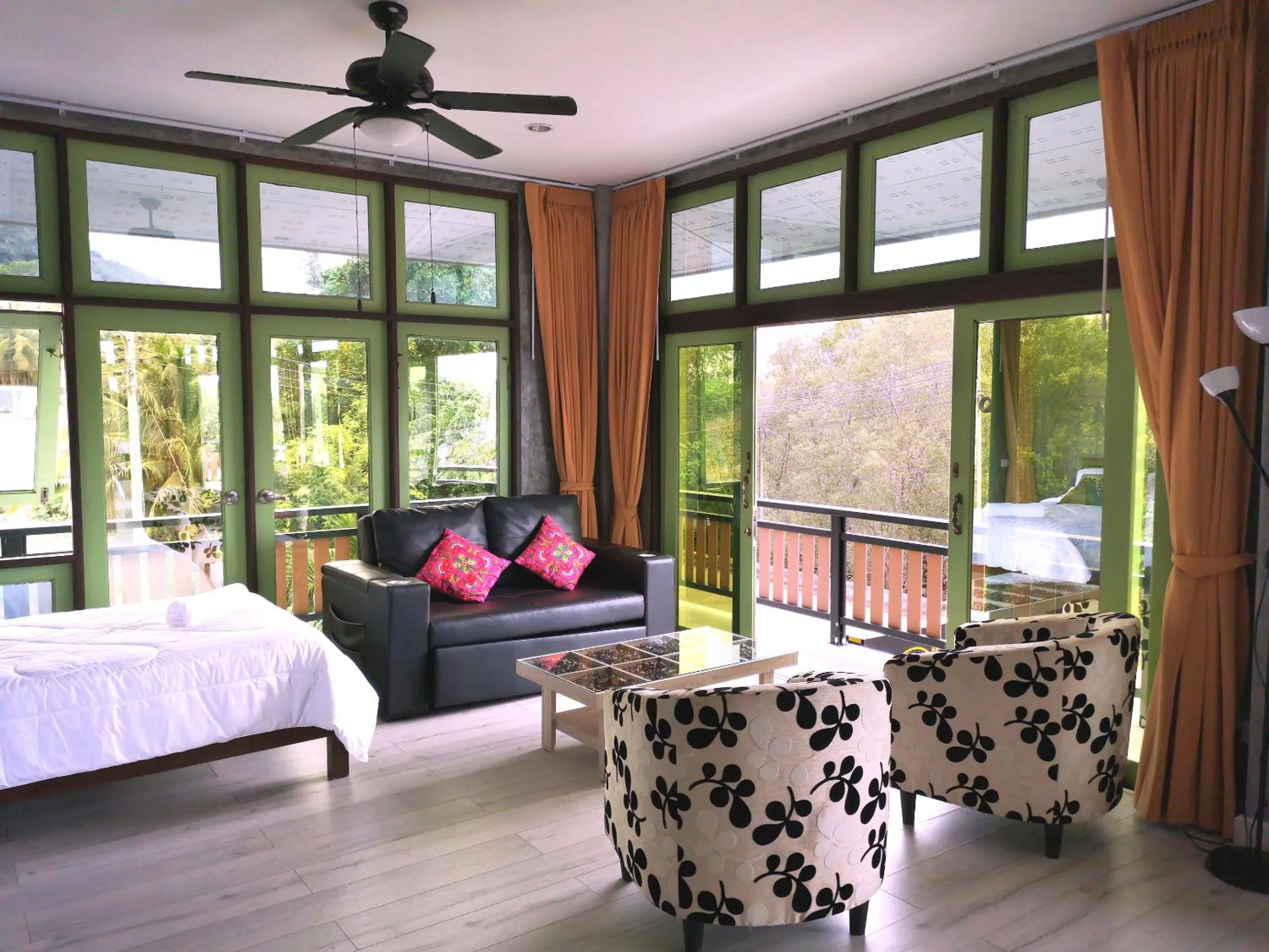 Living room, Bed in Tonmai Suites