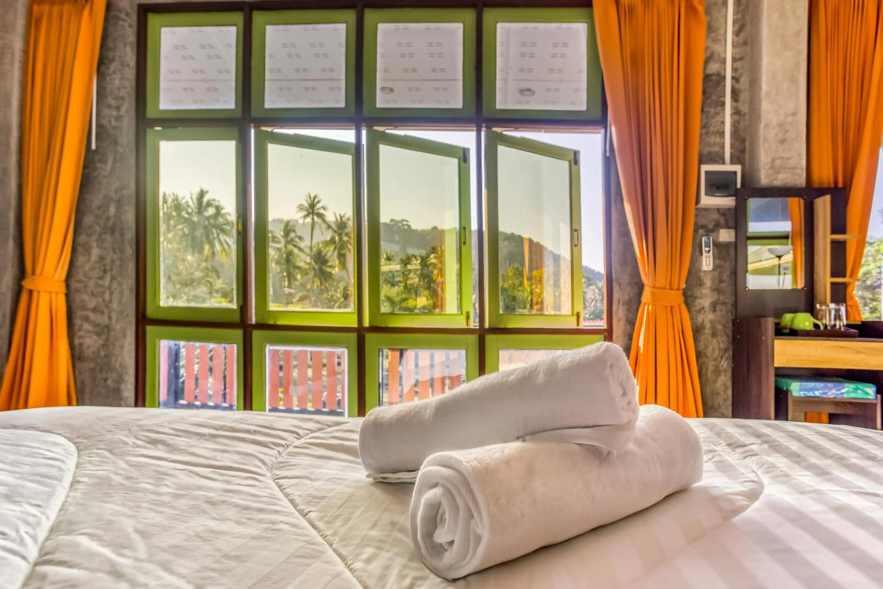 Bed in Tonmai Suites