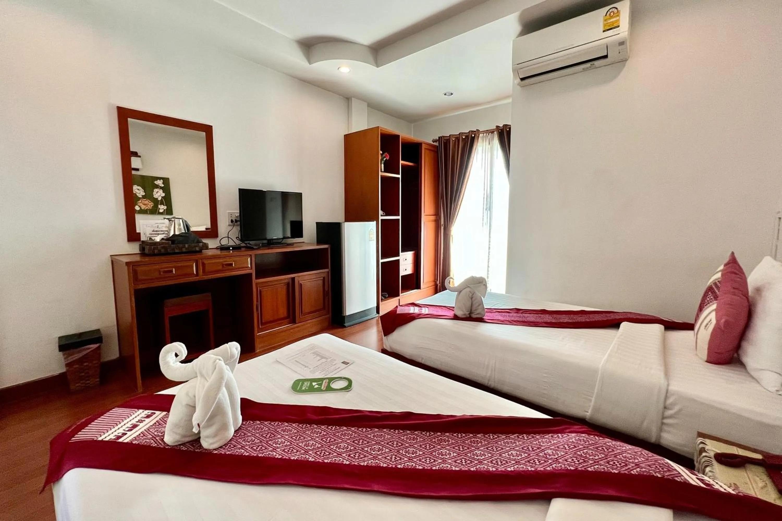 Bed in Sawadeelanna Hotel