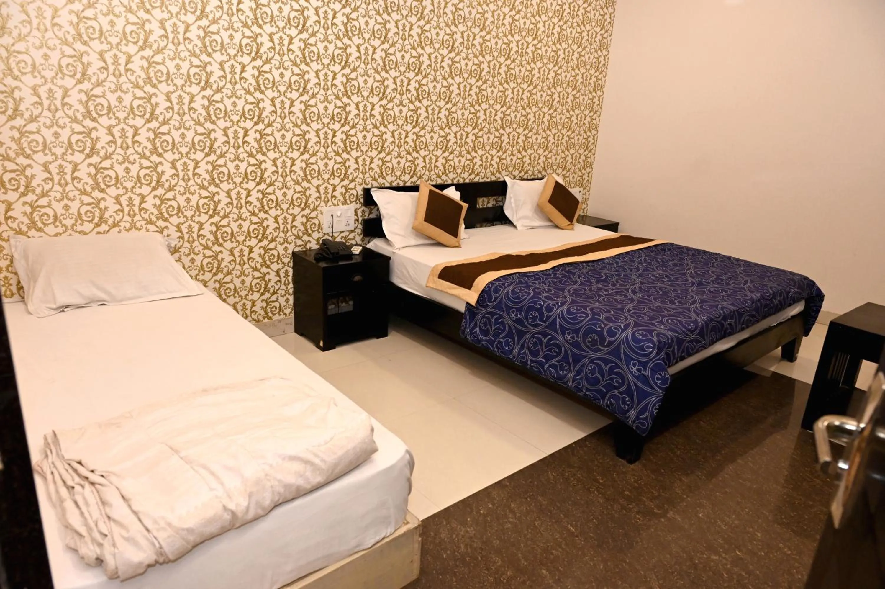 Bed in Om Heritage Haveli