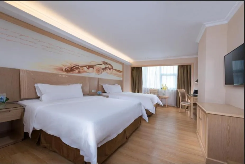 Bed in Vienna Hotel Shenzhen Haiwan
