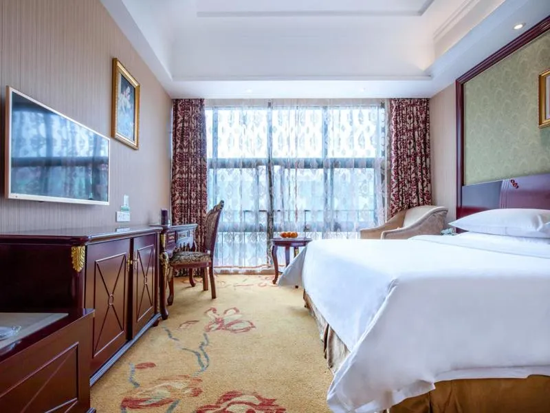 Bed in Vienna Hotel Shanghai Songjiang Wanda