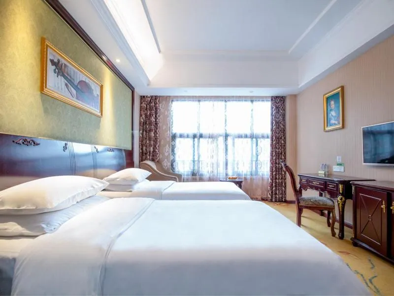 Bed in Vienna Hotel Shanghai Songjiang Wanda