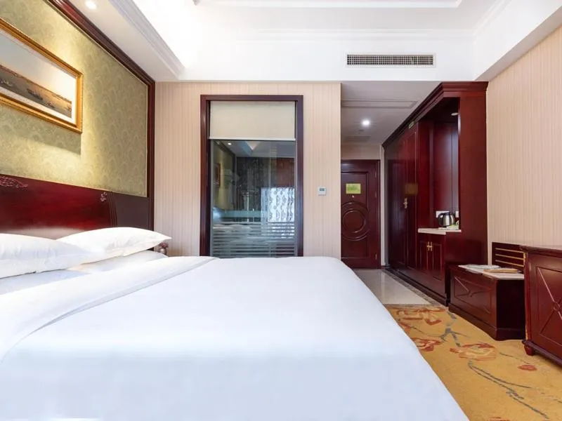 Bed in Vienna Hotel Shanghai Songjiang Wanda