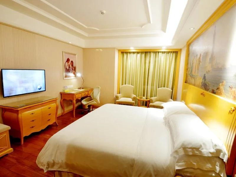 Bed in Vienna International Hotel Shenzhen Guangming Avenue