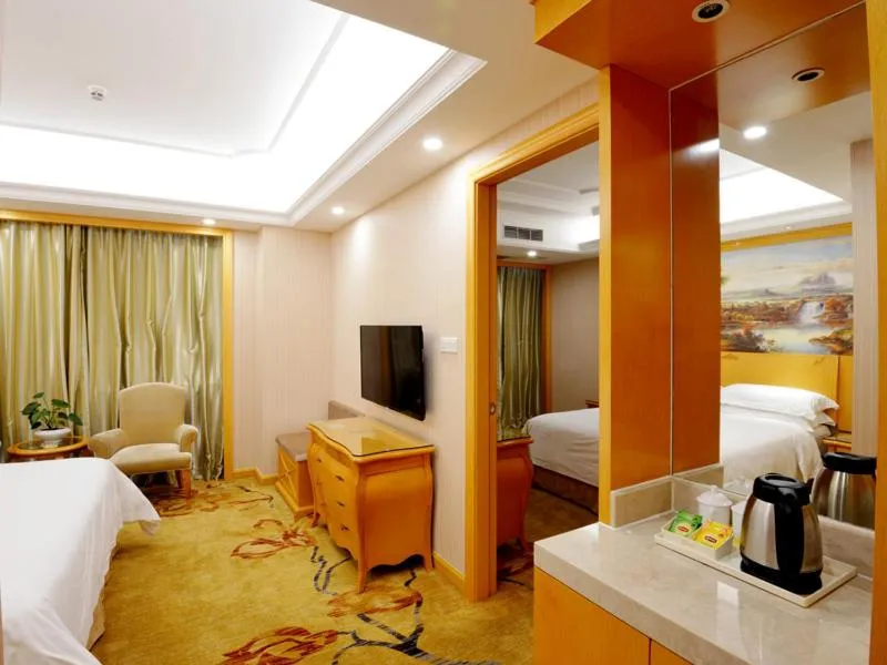 Bed in Vienna International Hotel Shenzhen Guangming Avenue
