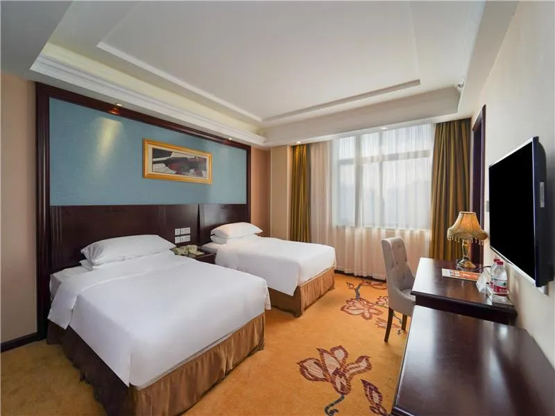 Bed in Vienna Hotel Shanghai Pudong Jinqiao Park