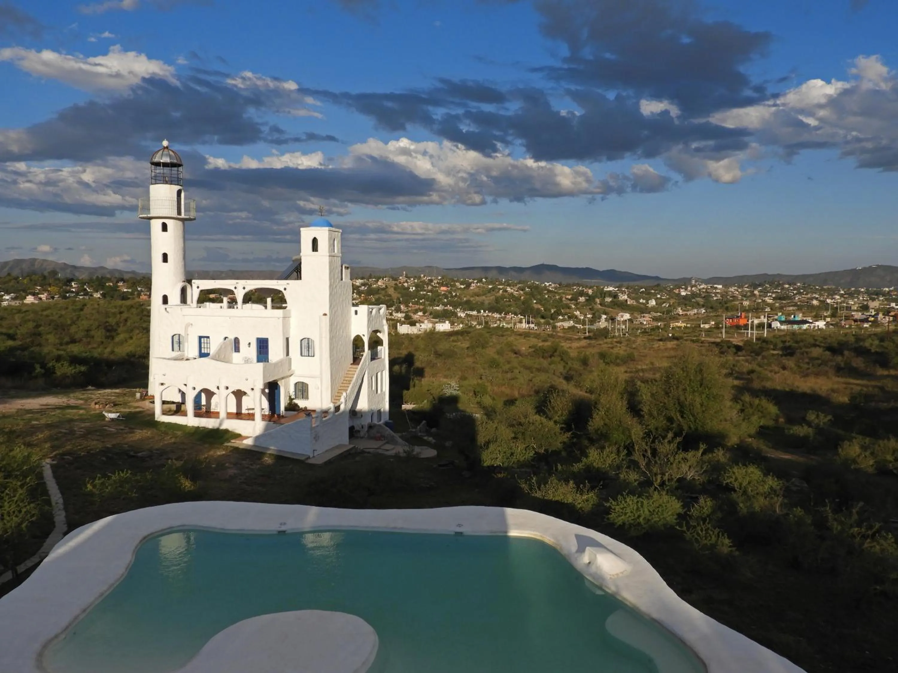 Property building in El Faro de Carpier - ApartHotel & Restaurante Bar Cafetería
