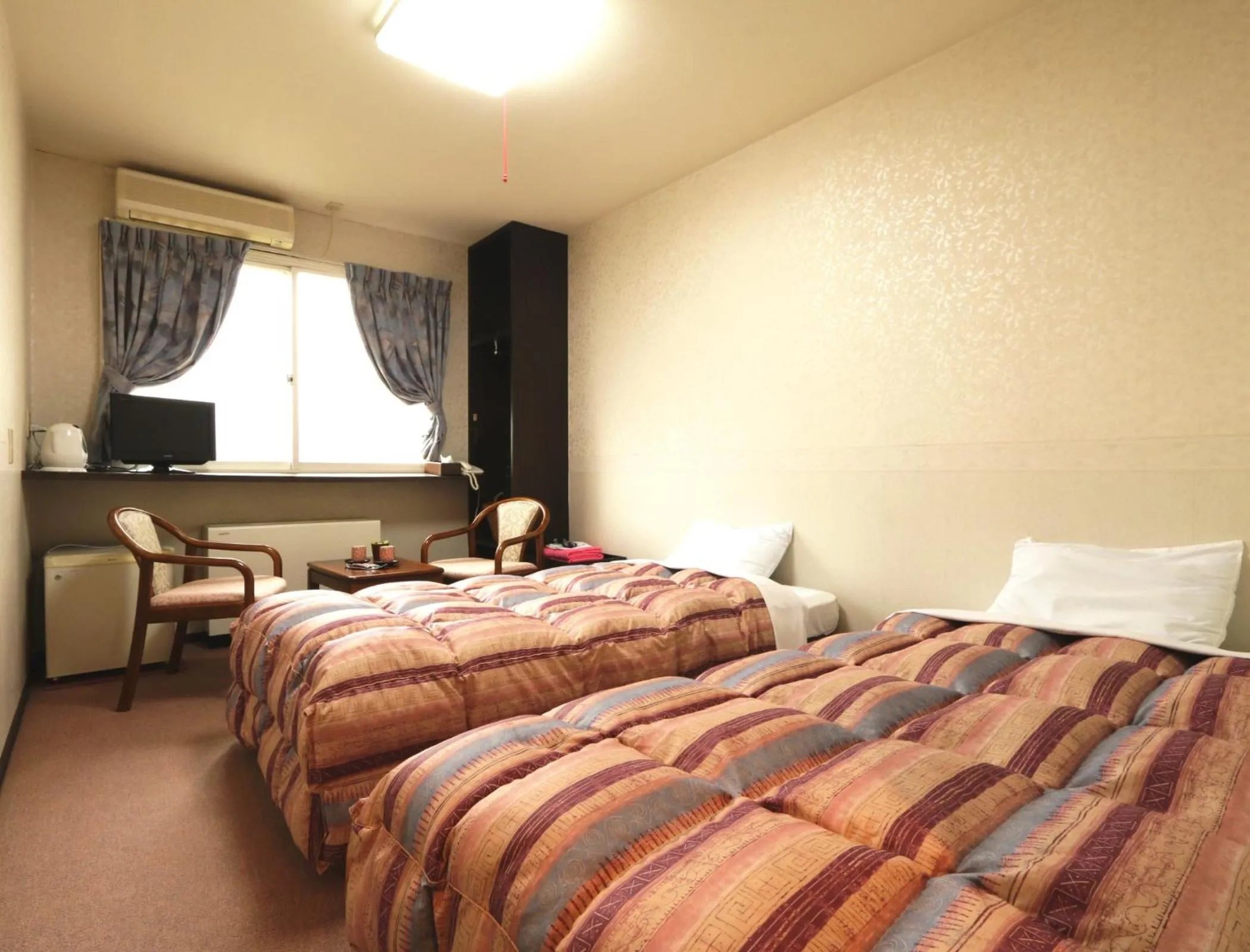 Photo of the whole room, Bed in Hakuba Tsugaike Sunrise Tanne