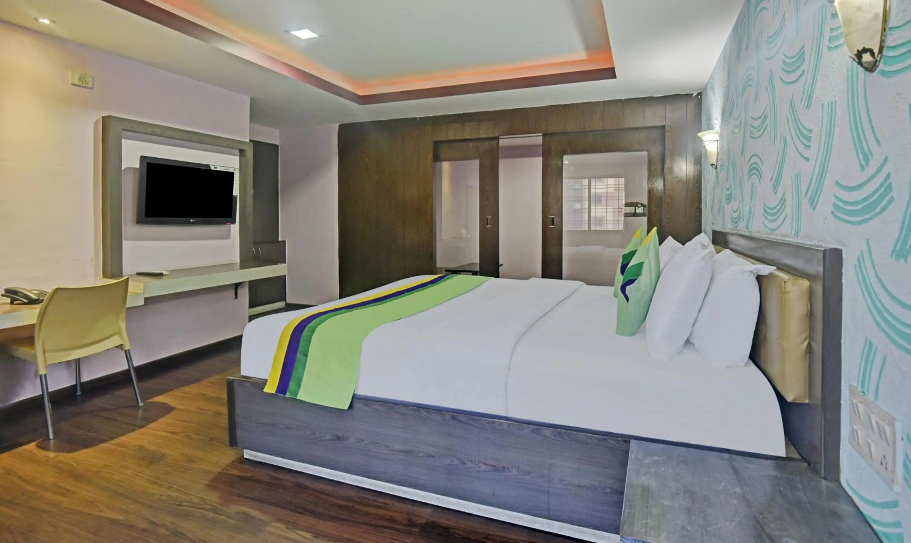 Bedroom, Bed in Treebo Savoury Sea Shell Residency