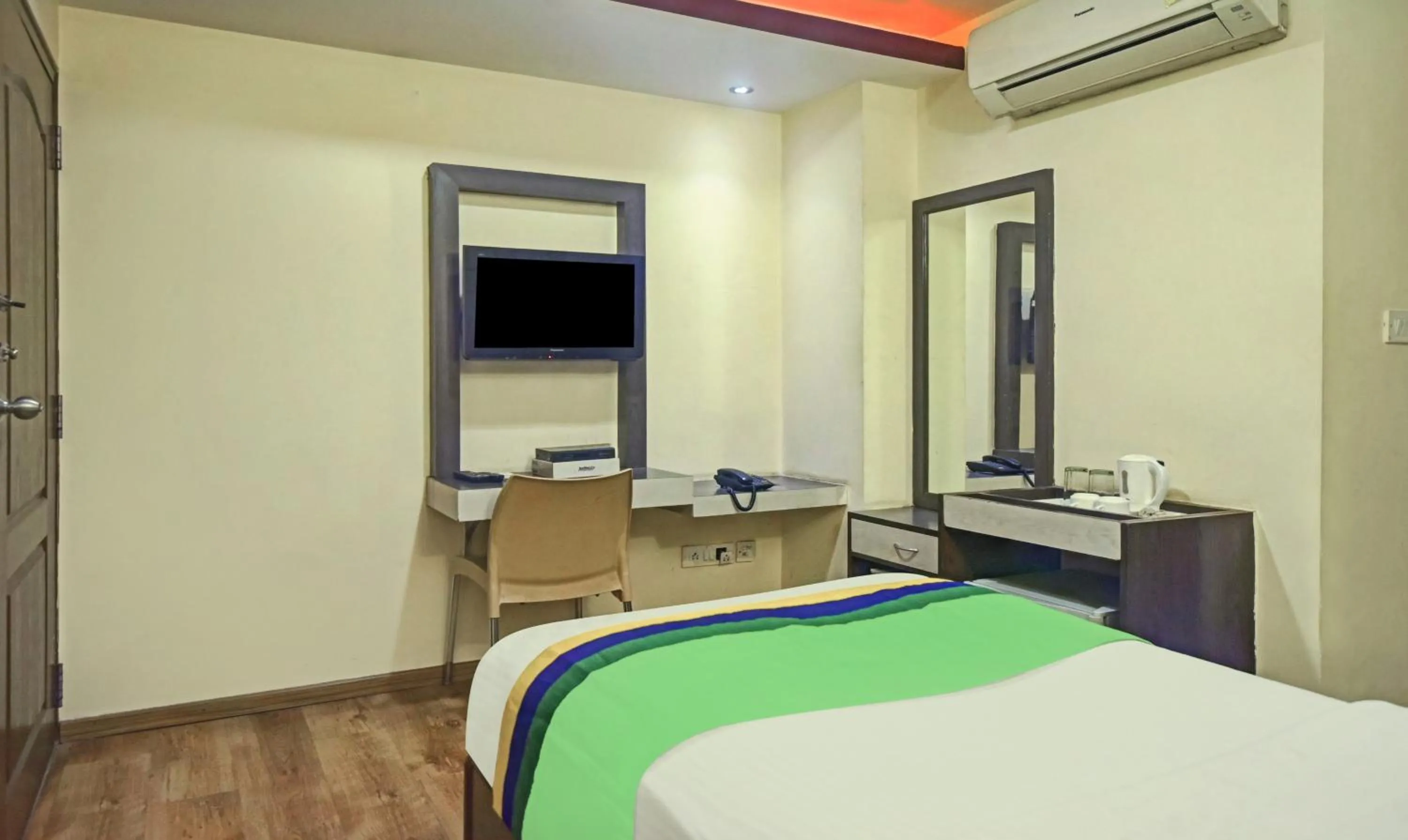 Bedroom, Bed in Treebo Savoury Sea Shell Residency