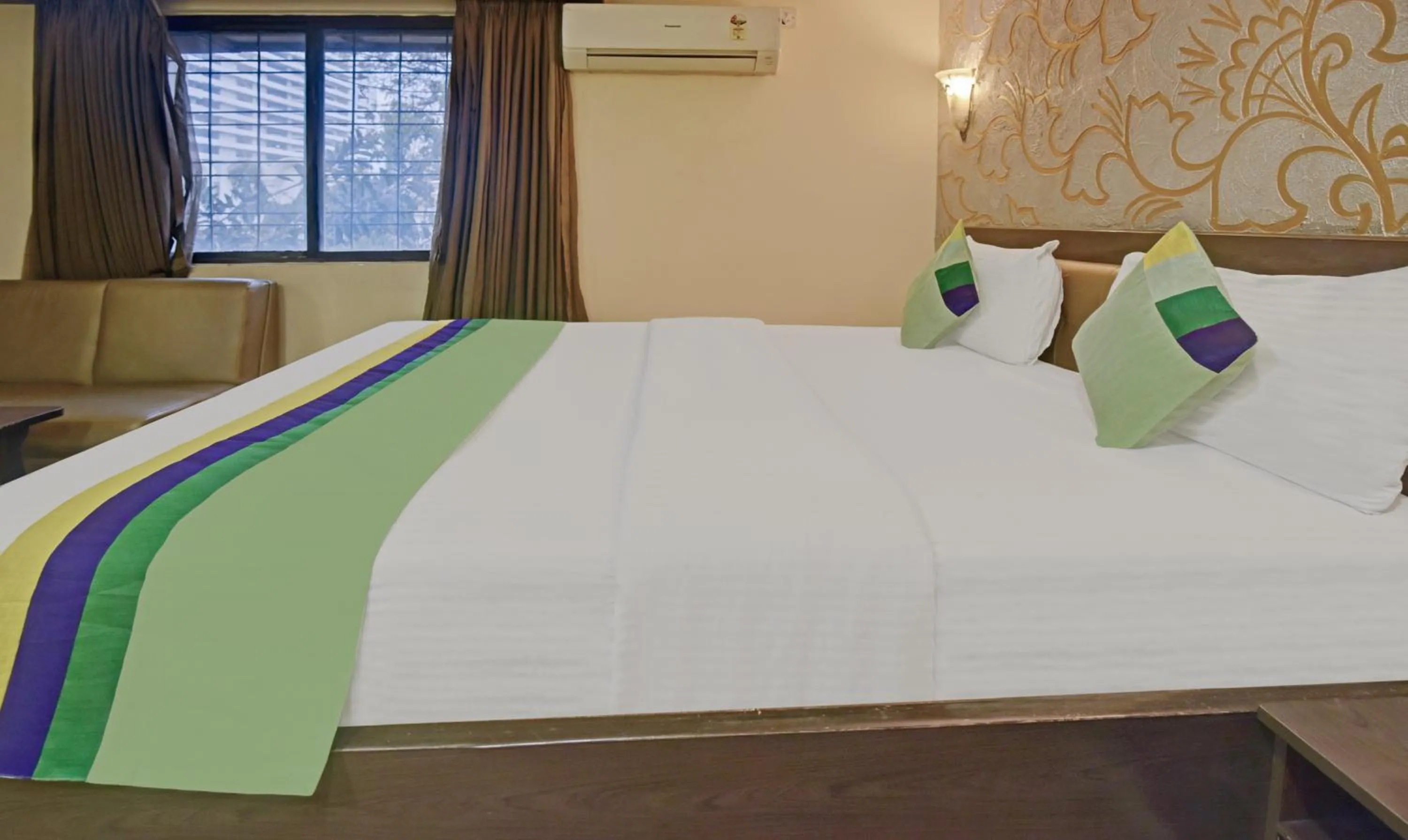 Bedroom, Bed in Treebo Savoury Sea Shell Residency