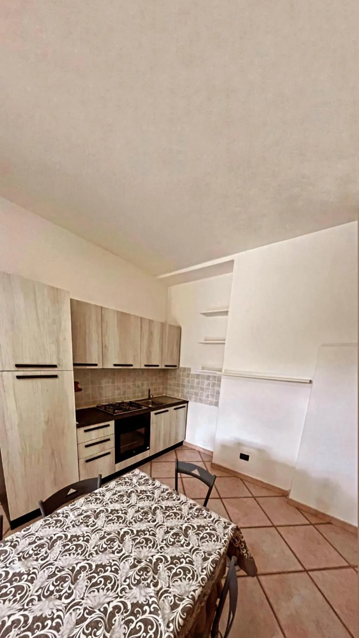 Kitchen or kitchenette in Case Vacanze Le Buganville