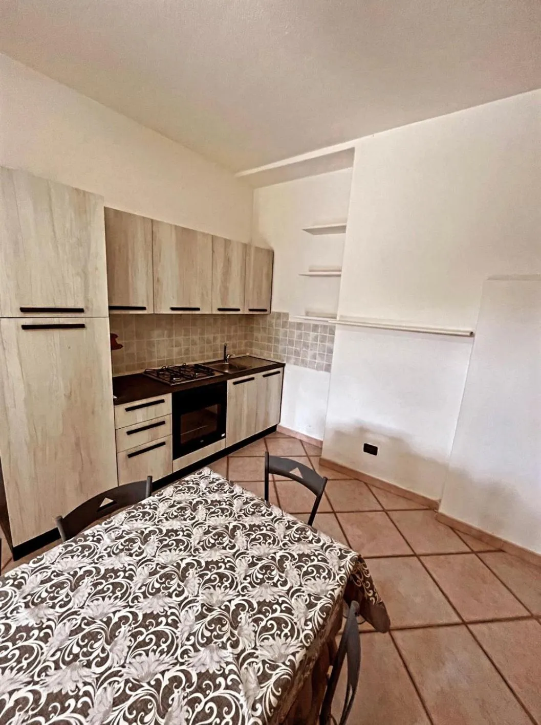 Kitchen or kitchenette in Case Vacanze Le Buganville