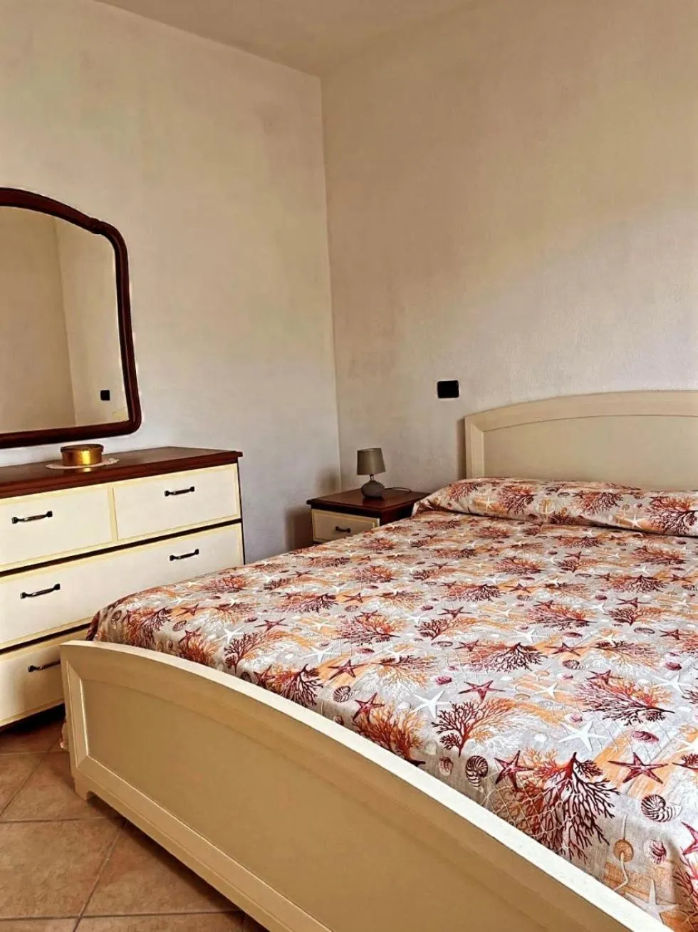 Bedroom in Case Vacanze Le Buganville