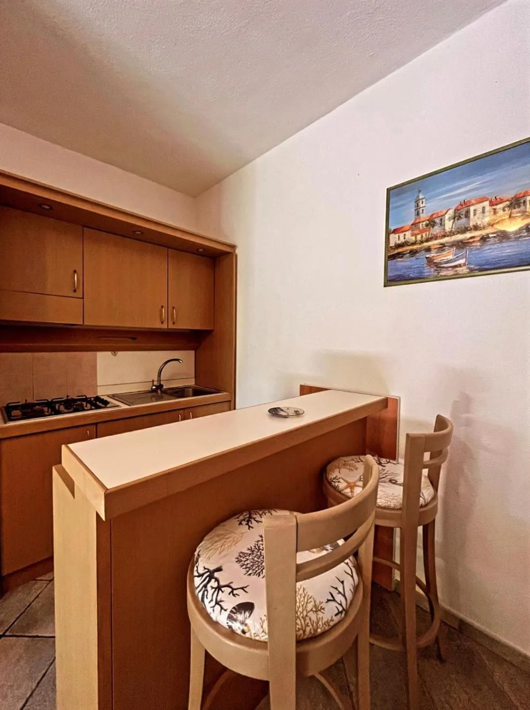 Kitchen or kitchenette in Case Vacanze Le Buganville