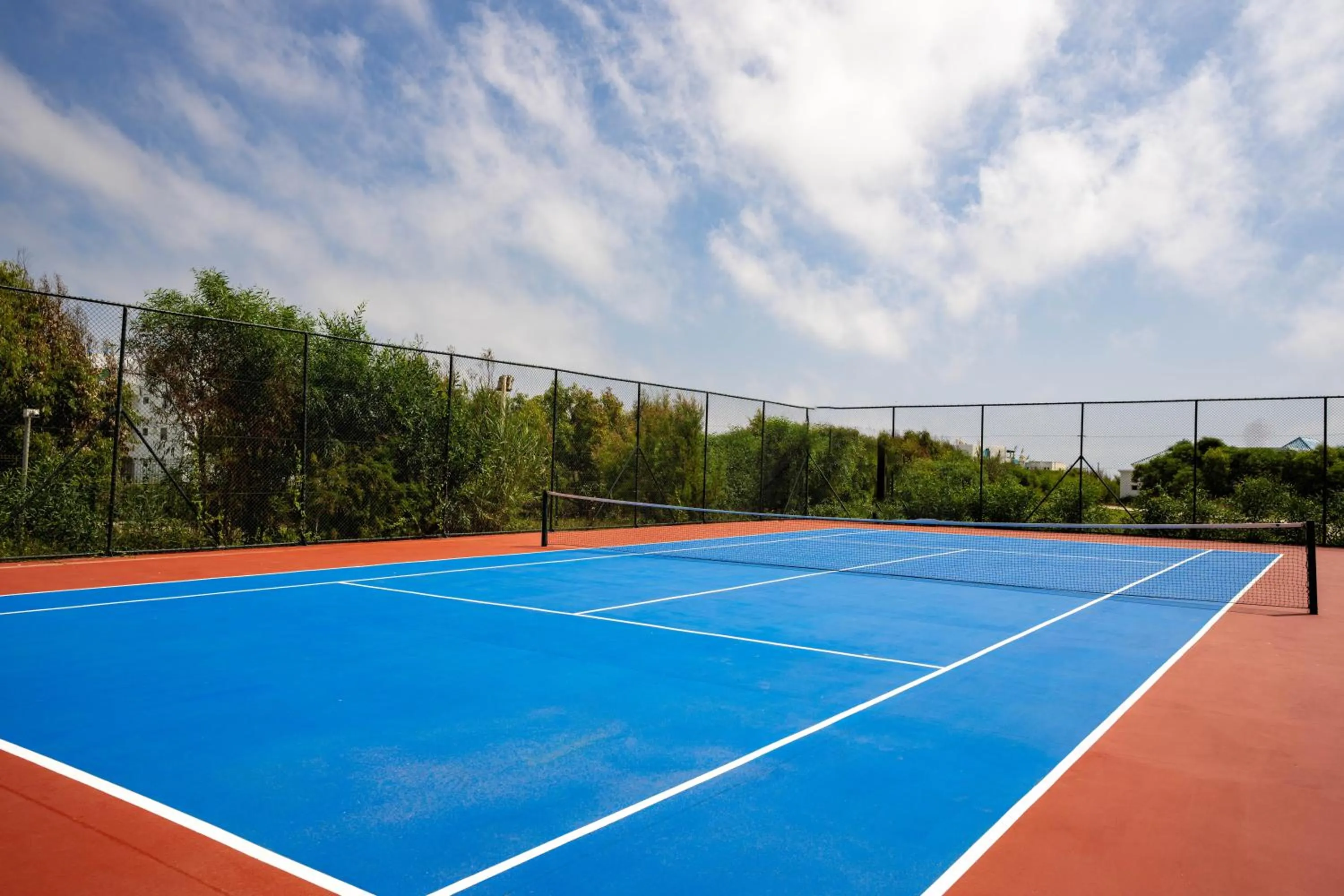 Tennis court in Banyan Tree Tamouda Bay