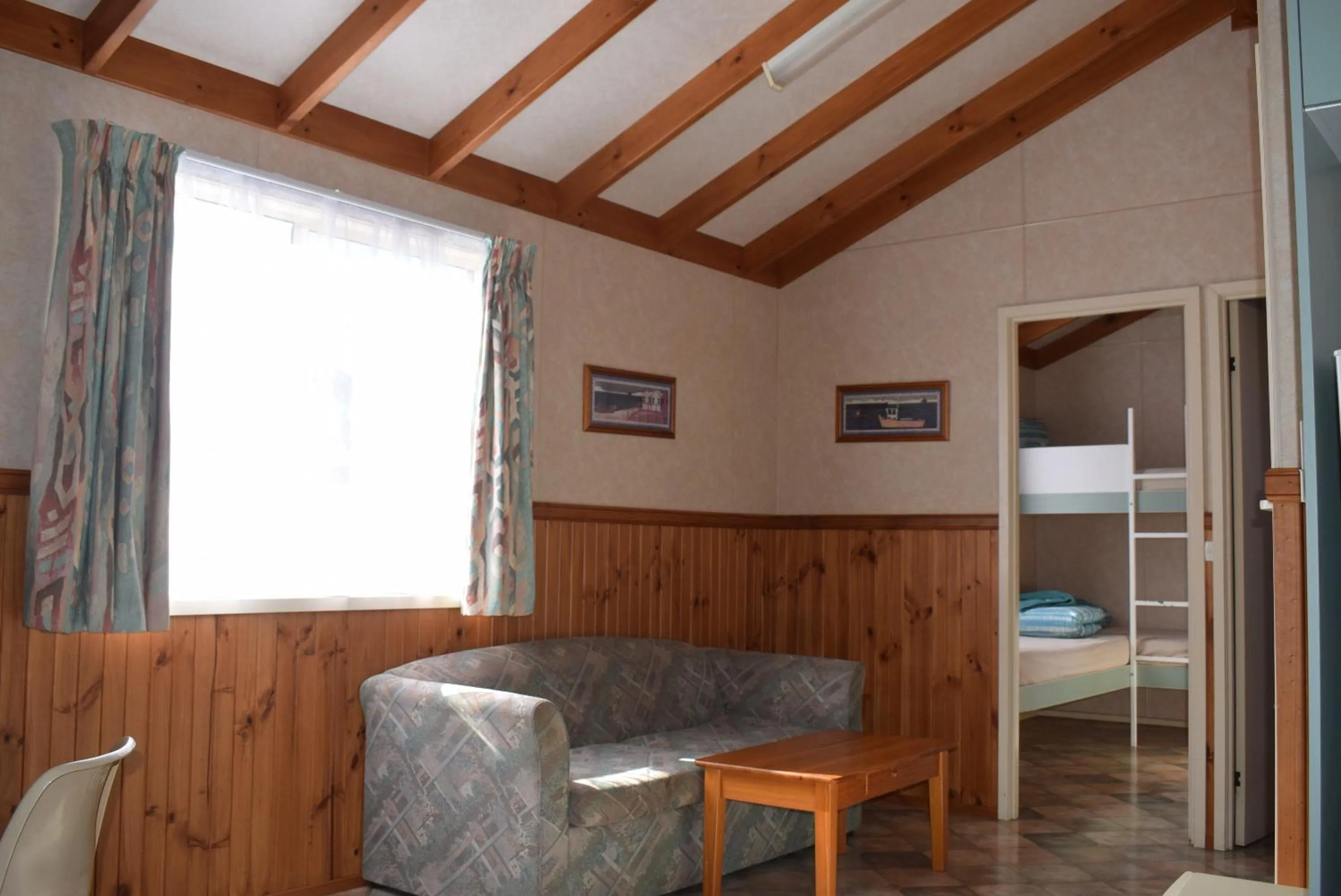 Seating area, Bed in Bega Caravan Park