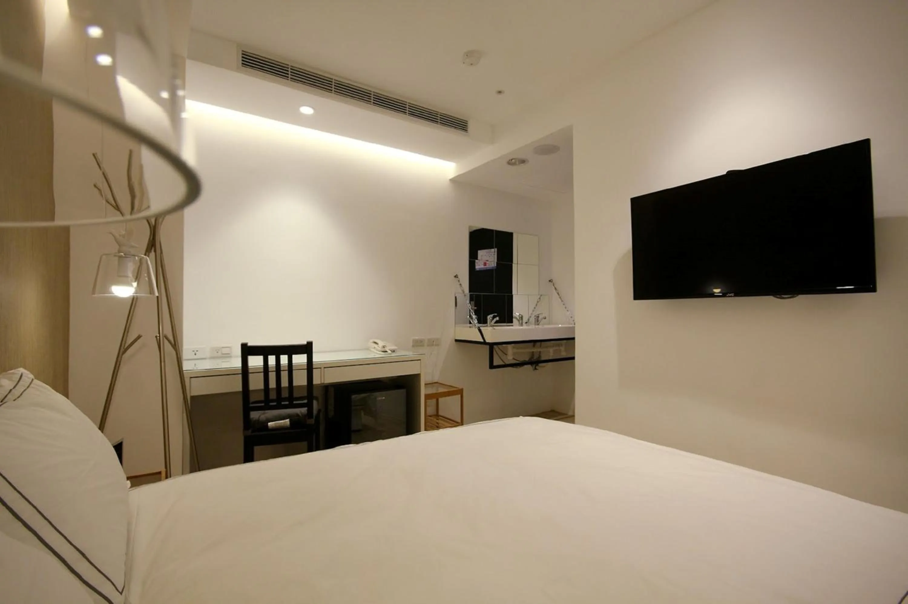 Bed in Mini West Hotel