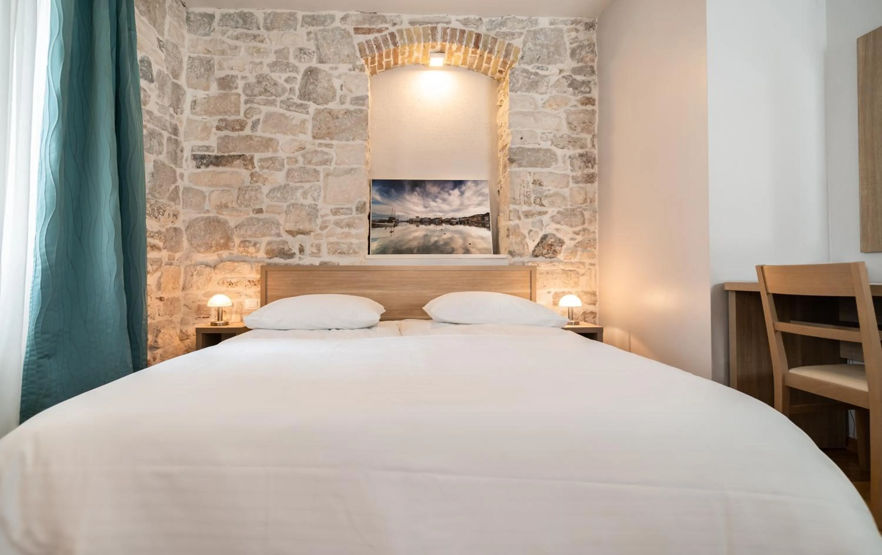 Bed in Tifani Luxury Rooms 2