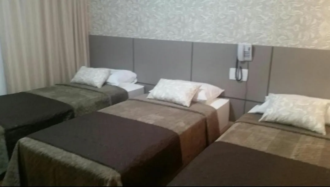 Bed in Hotel Caju de Ouro