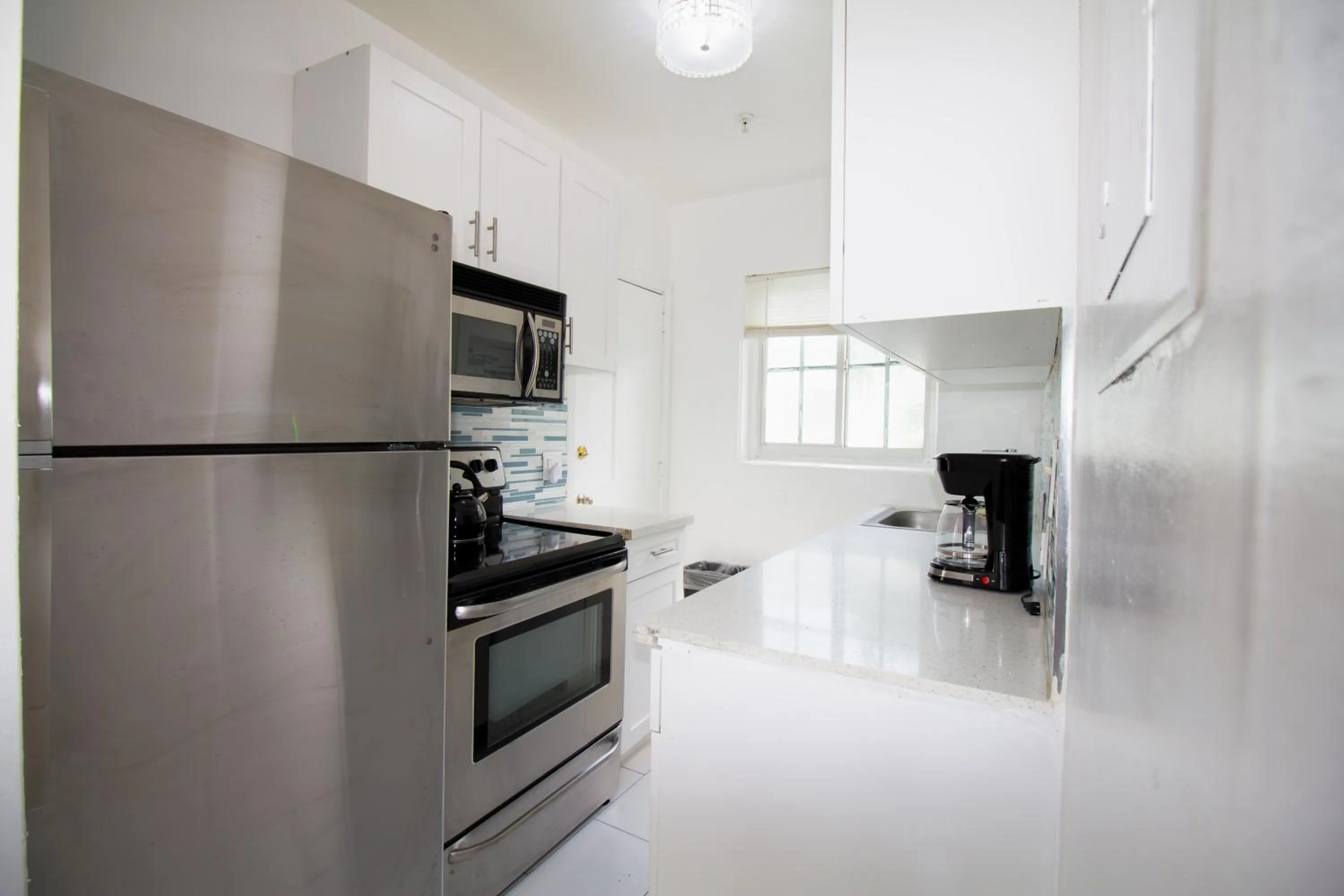 Kitchen or kitchenette in Courtyard Apartments Part of the Oasis Casita Collection