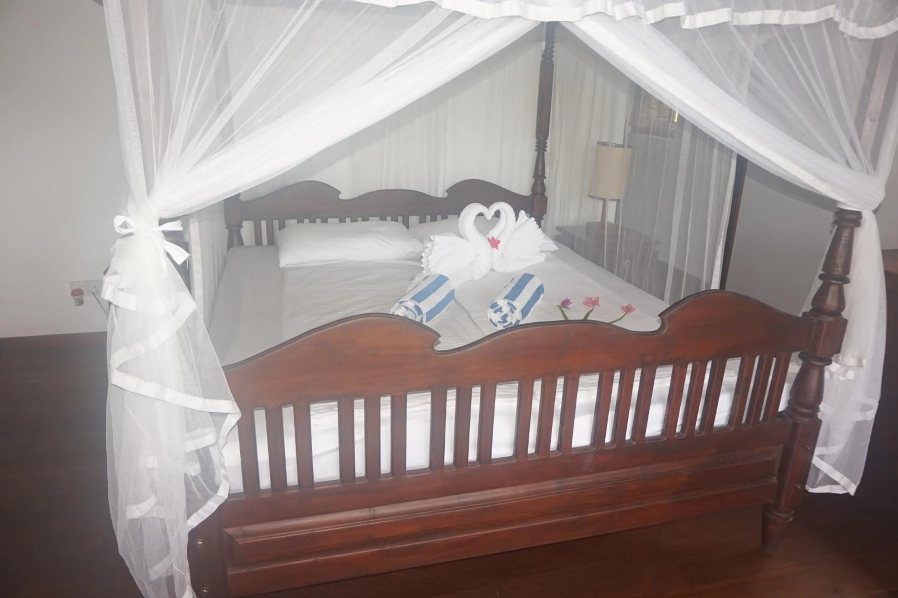 Bed in Lanka Beach Bungalows