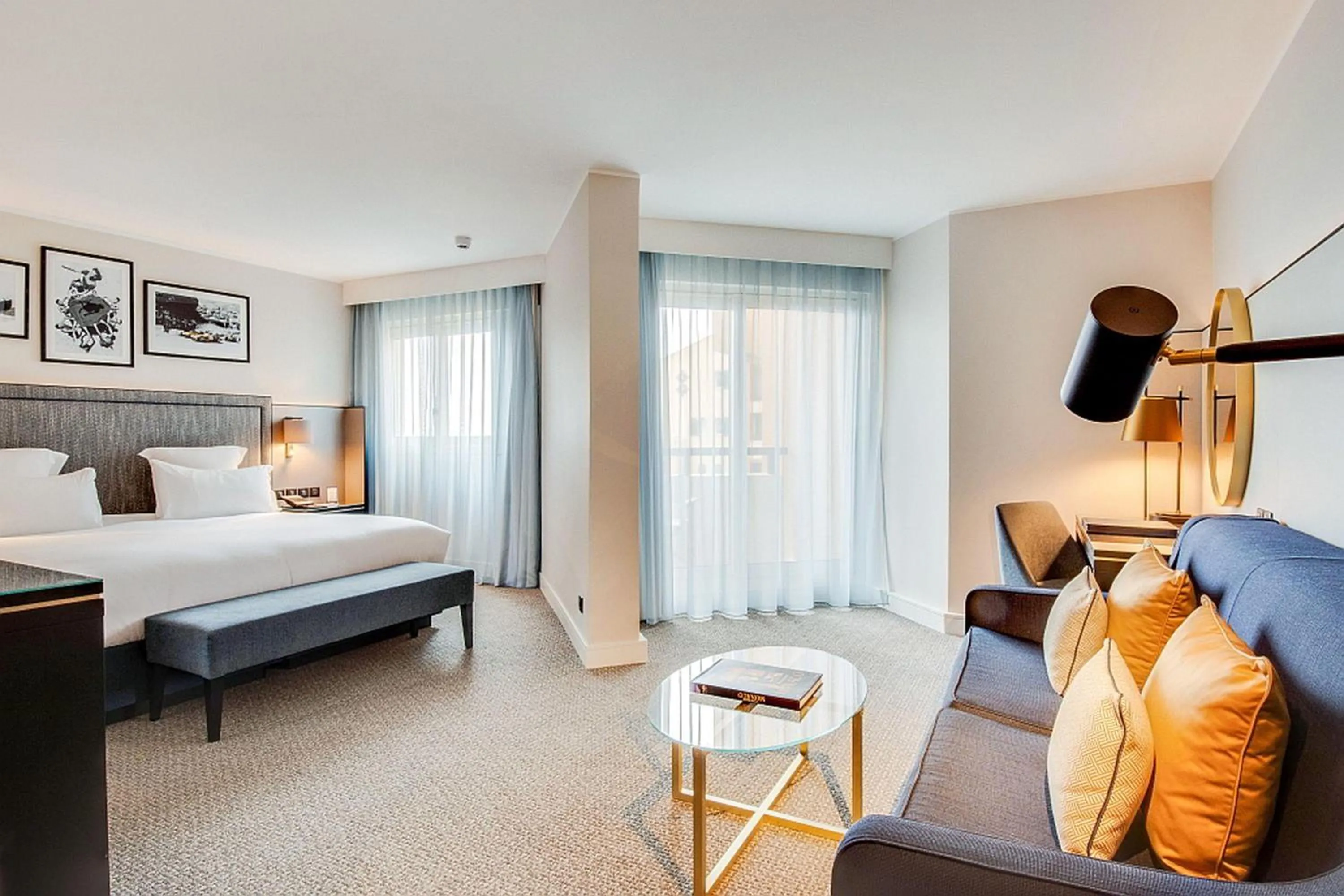 Living room, Bed in Columbus Hotel Monte-Carlo, Curio Collection by Hilton