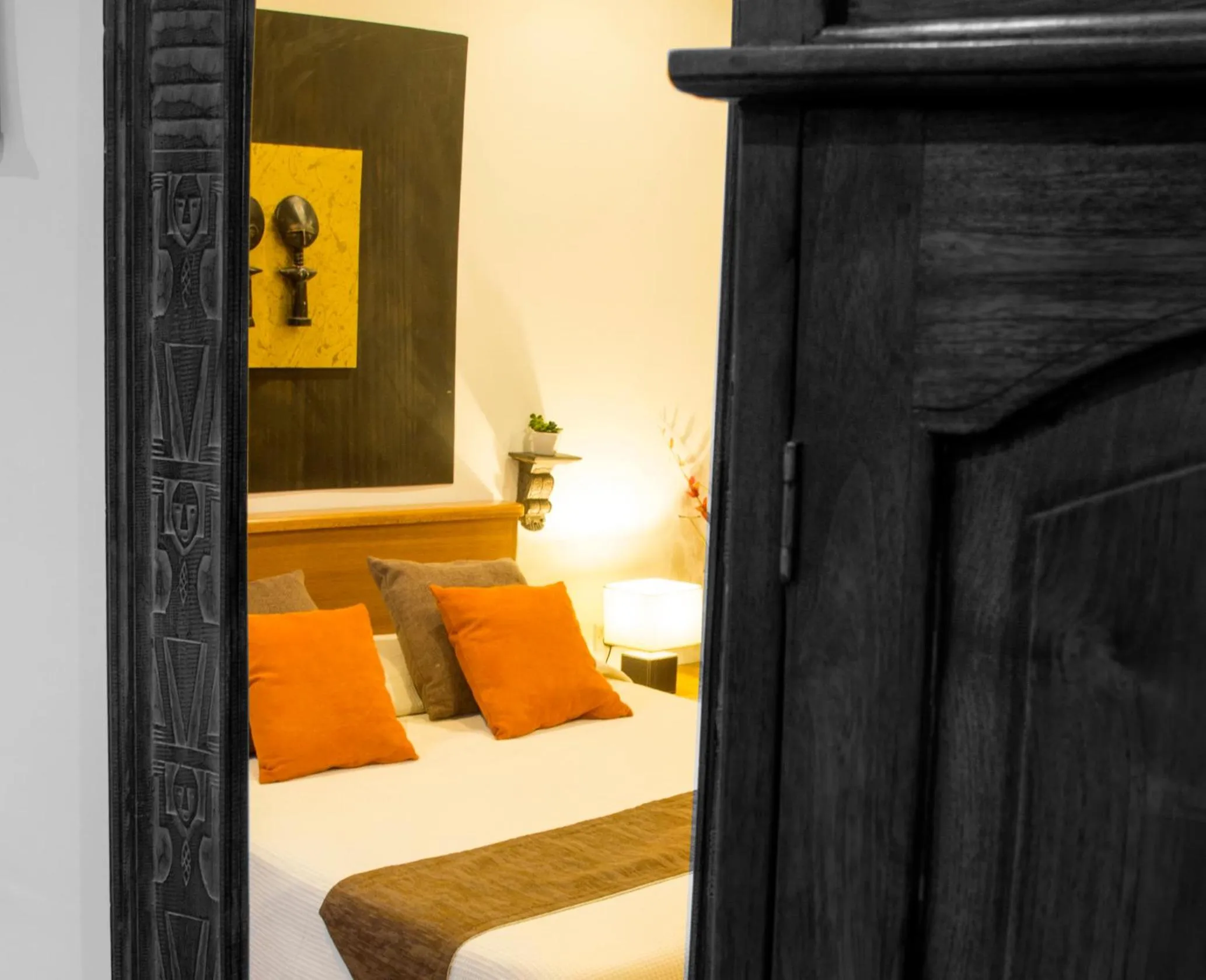 Decorative detail, Bed in Three Cities Apartments