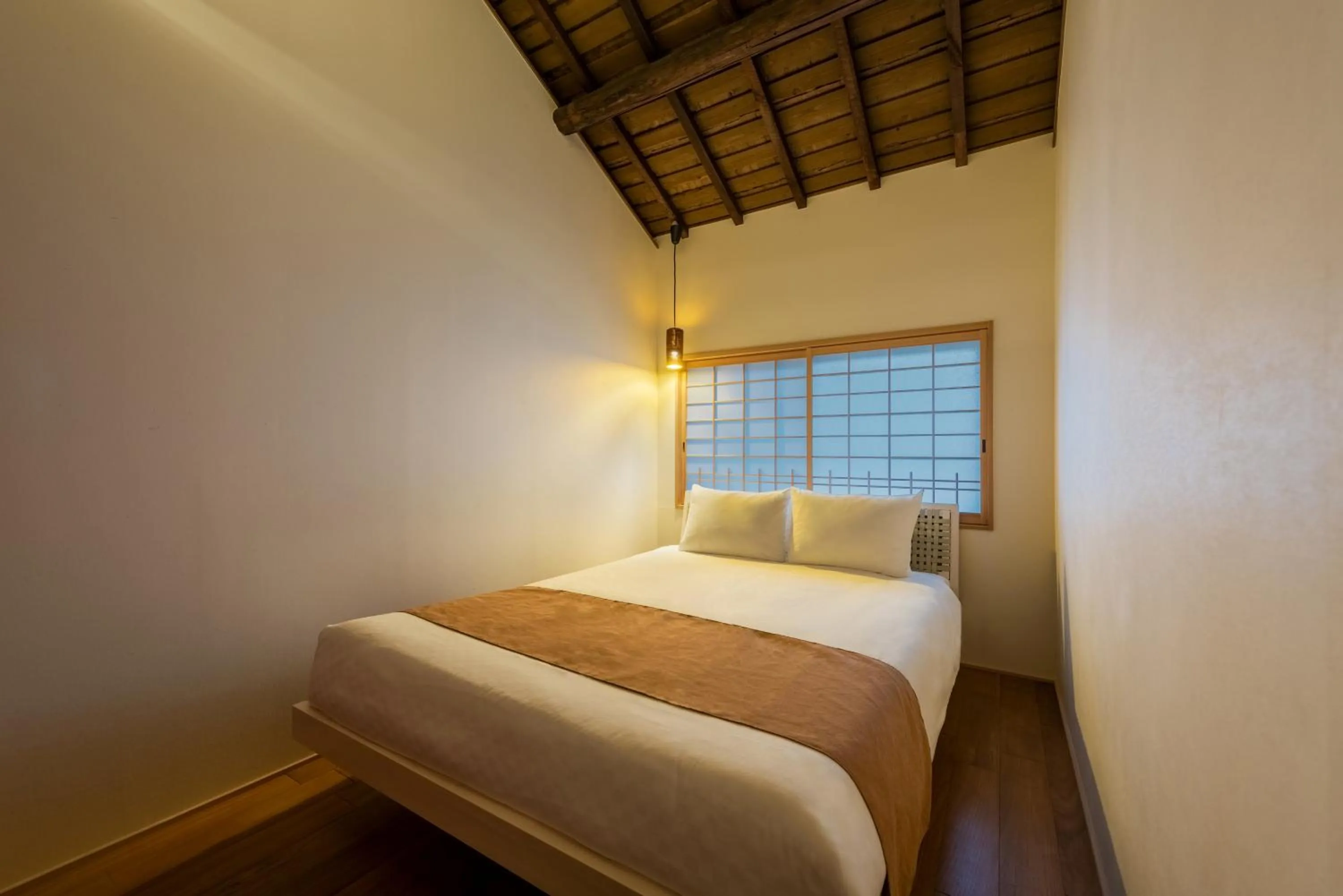 Bed in Choya Chawanzaka Machiya House