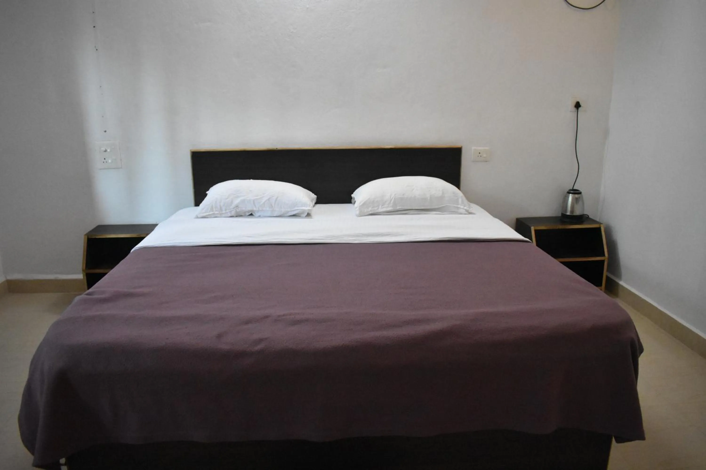 Bed in Club Palolem Resort