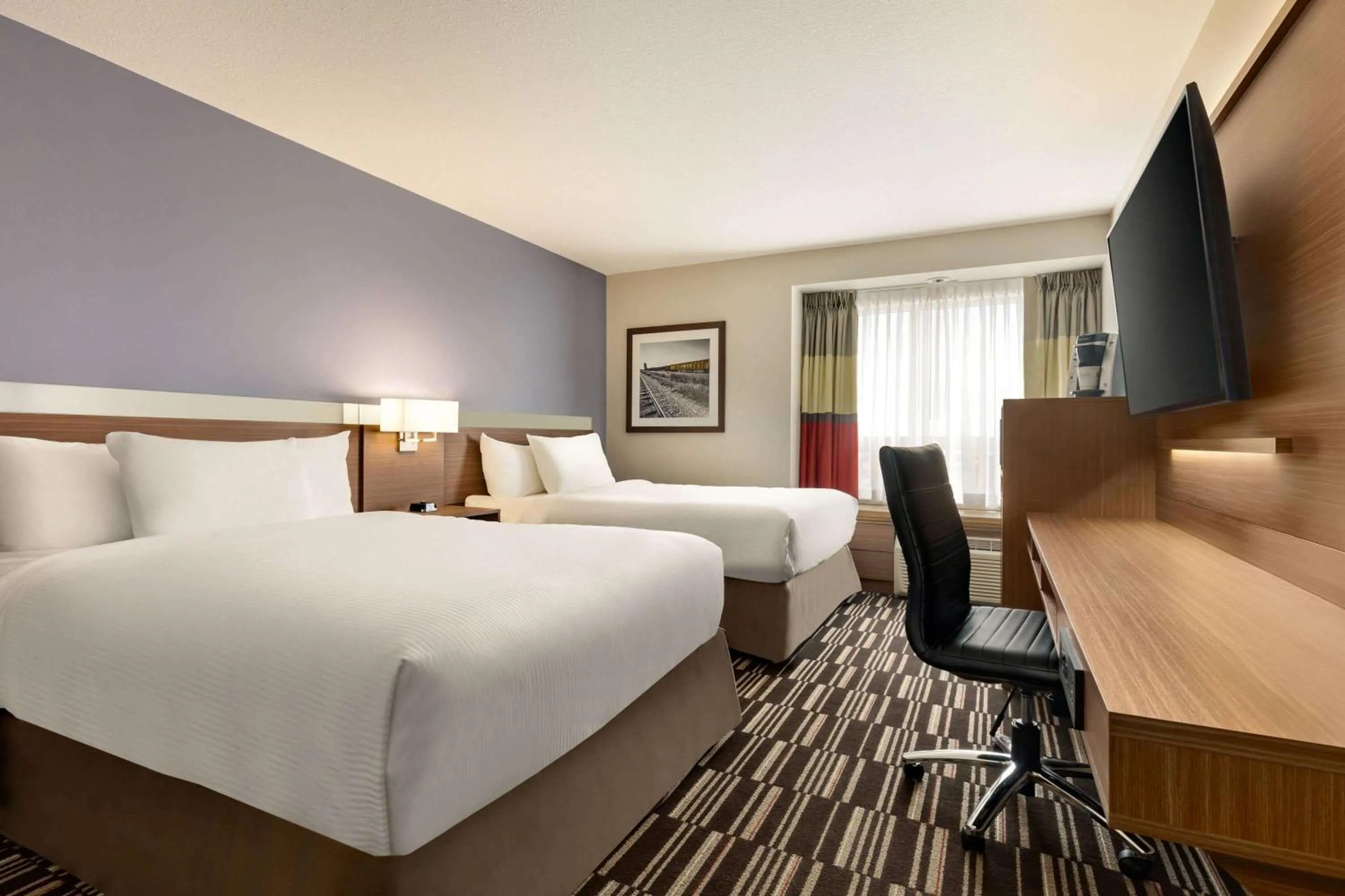 Photo of the whole room, Bed in Microtel Inn & Suites by Wyndham Bonnyville
