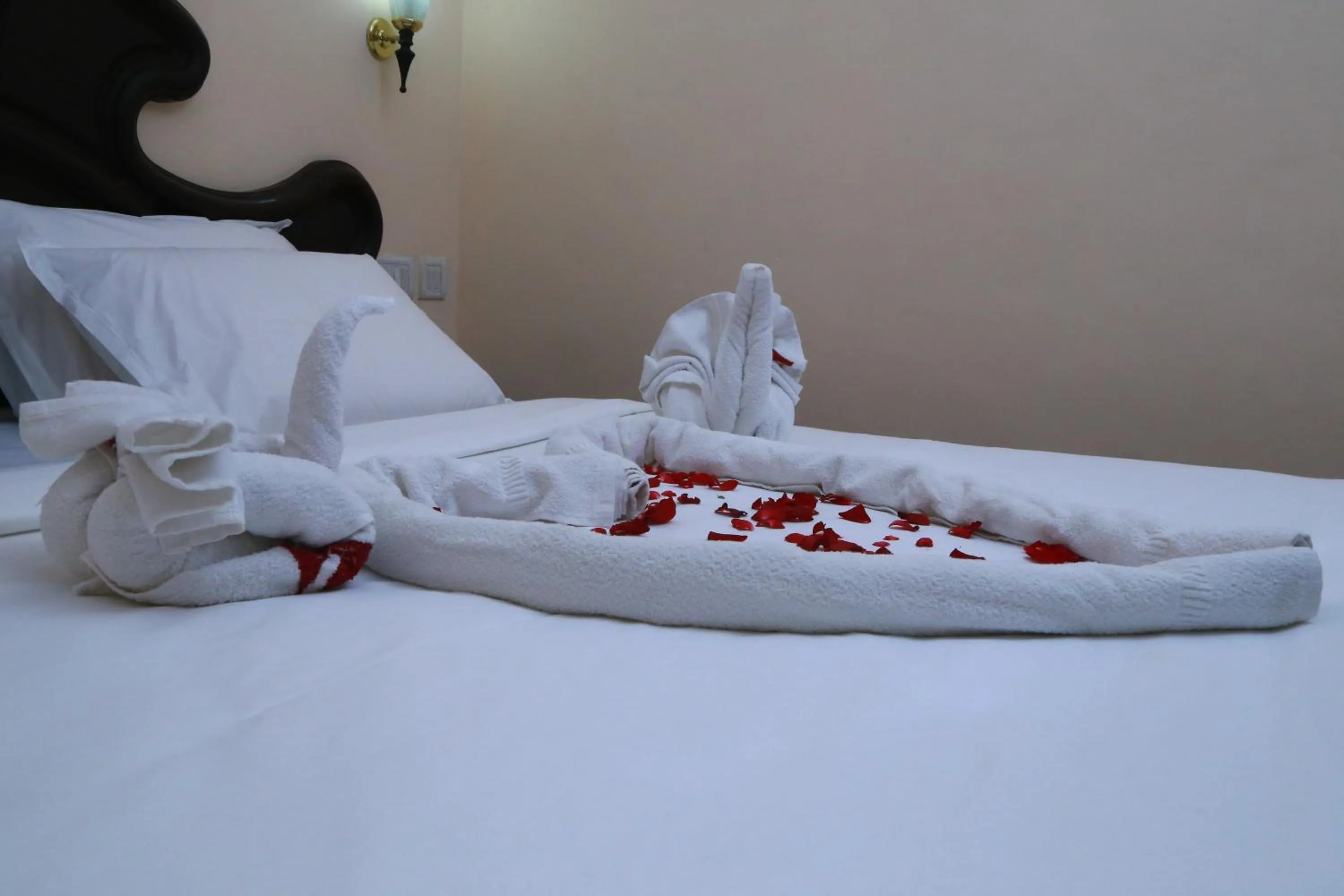 Decorative detail, Bed in Orison Residency Hotel