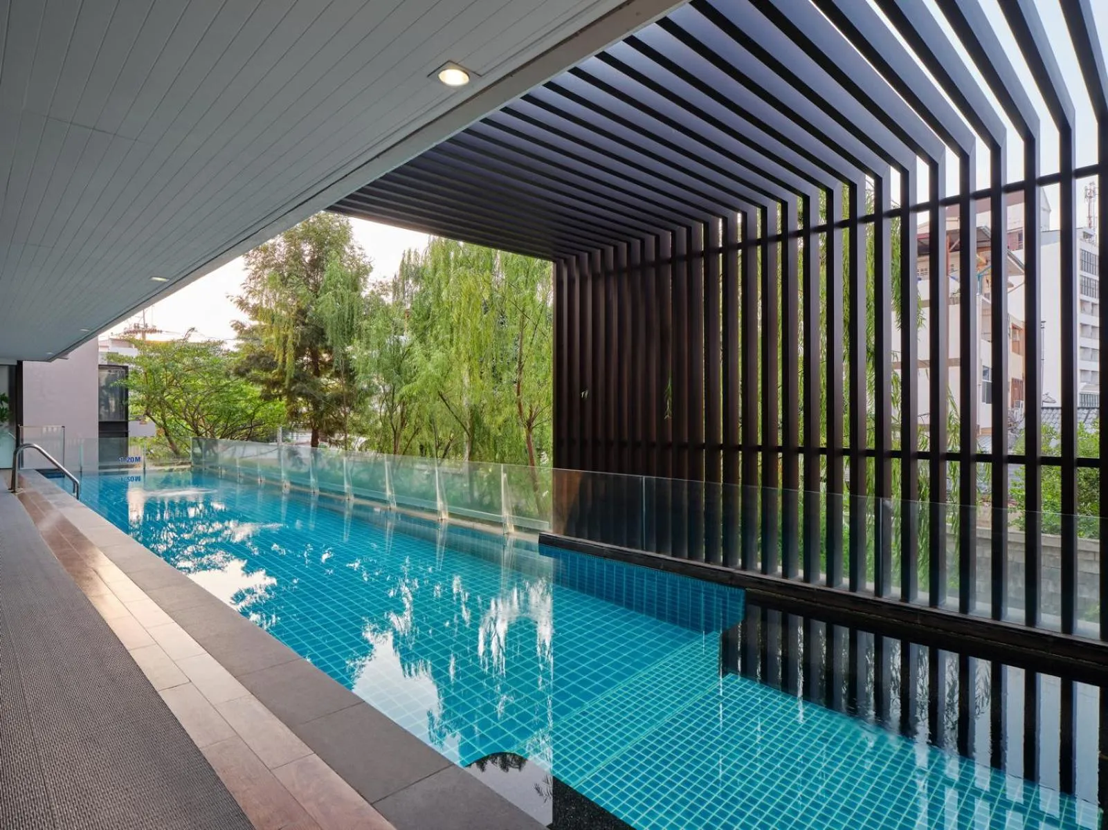 Swimming pool in Aster Hotel and Residence by At Mind