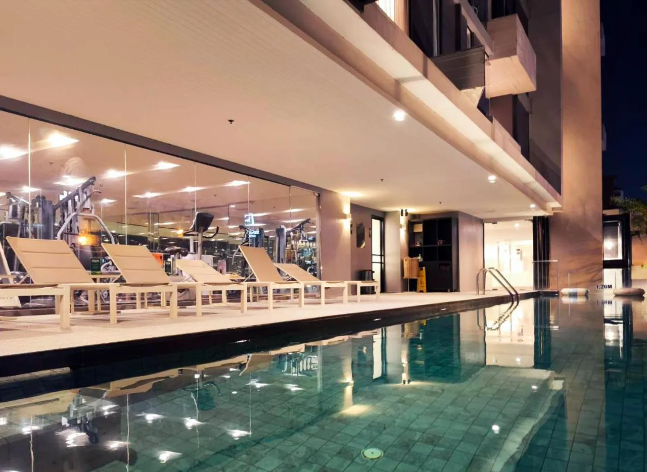 Swimming pool in Aster Hotel and Residence by At Mind