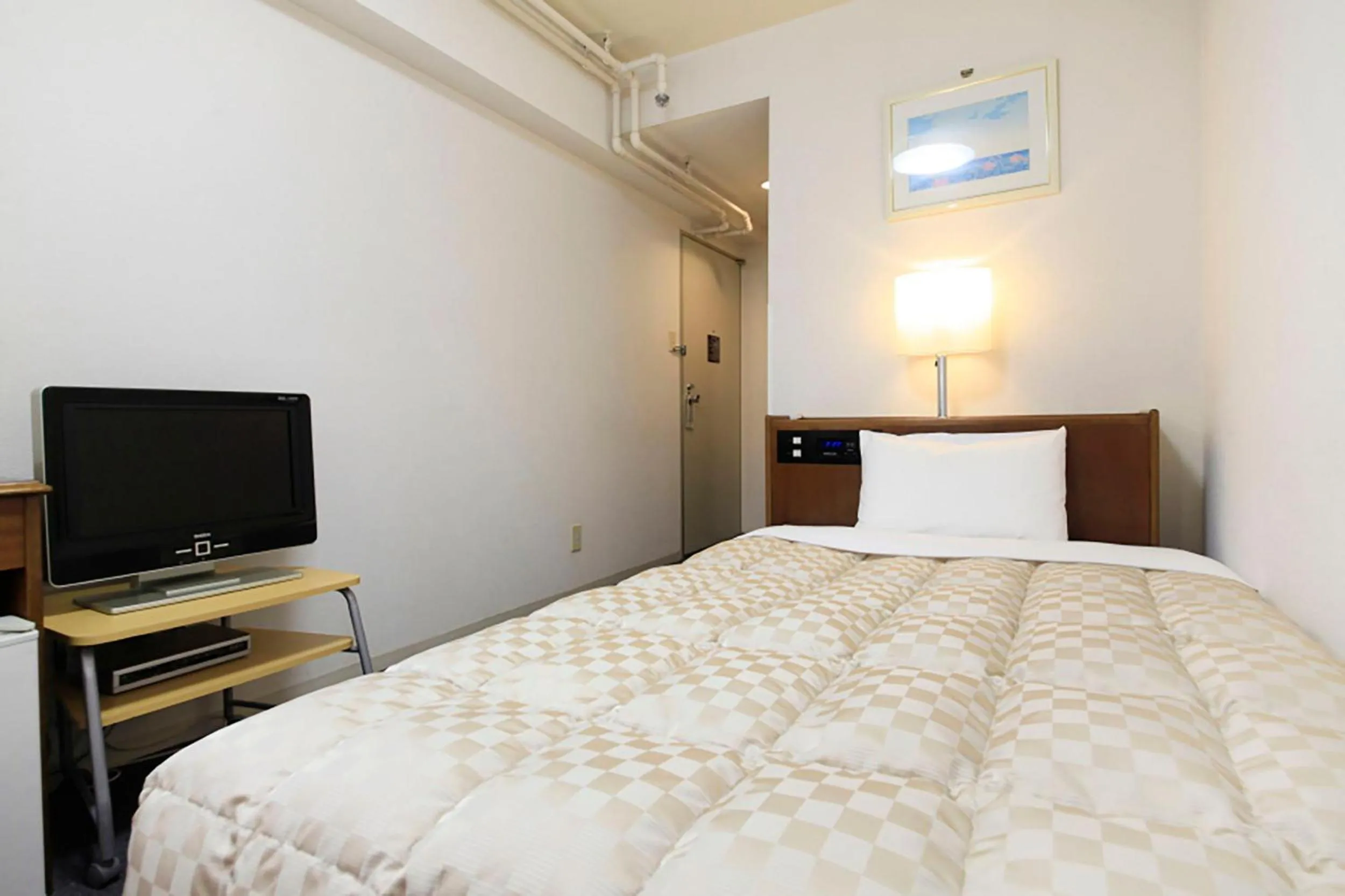 Bed in Shinjuku Urban Hotel