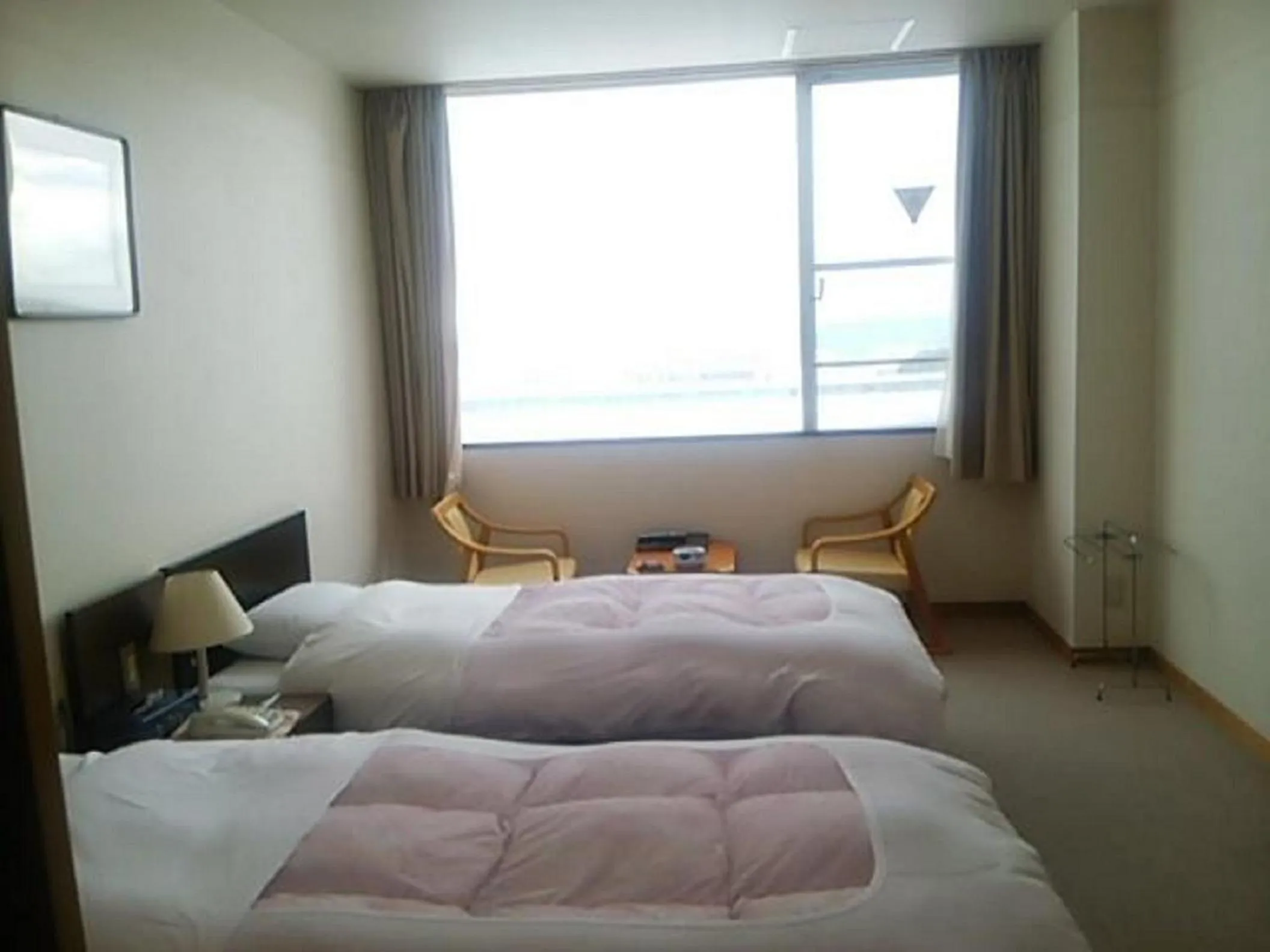 Photo of the whole room, Bed in Hotel Tetora Resort Tsuruoka
