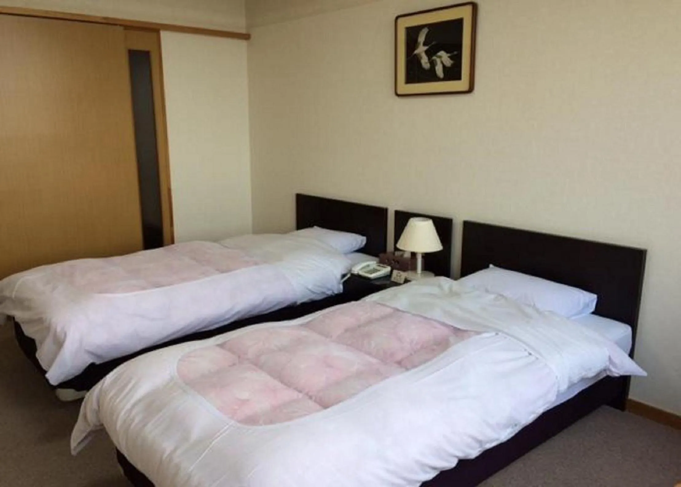 Photo of the whole room, Bed in Hotel Tetora Resort Tsuruoka