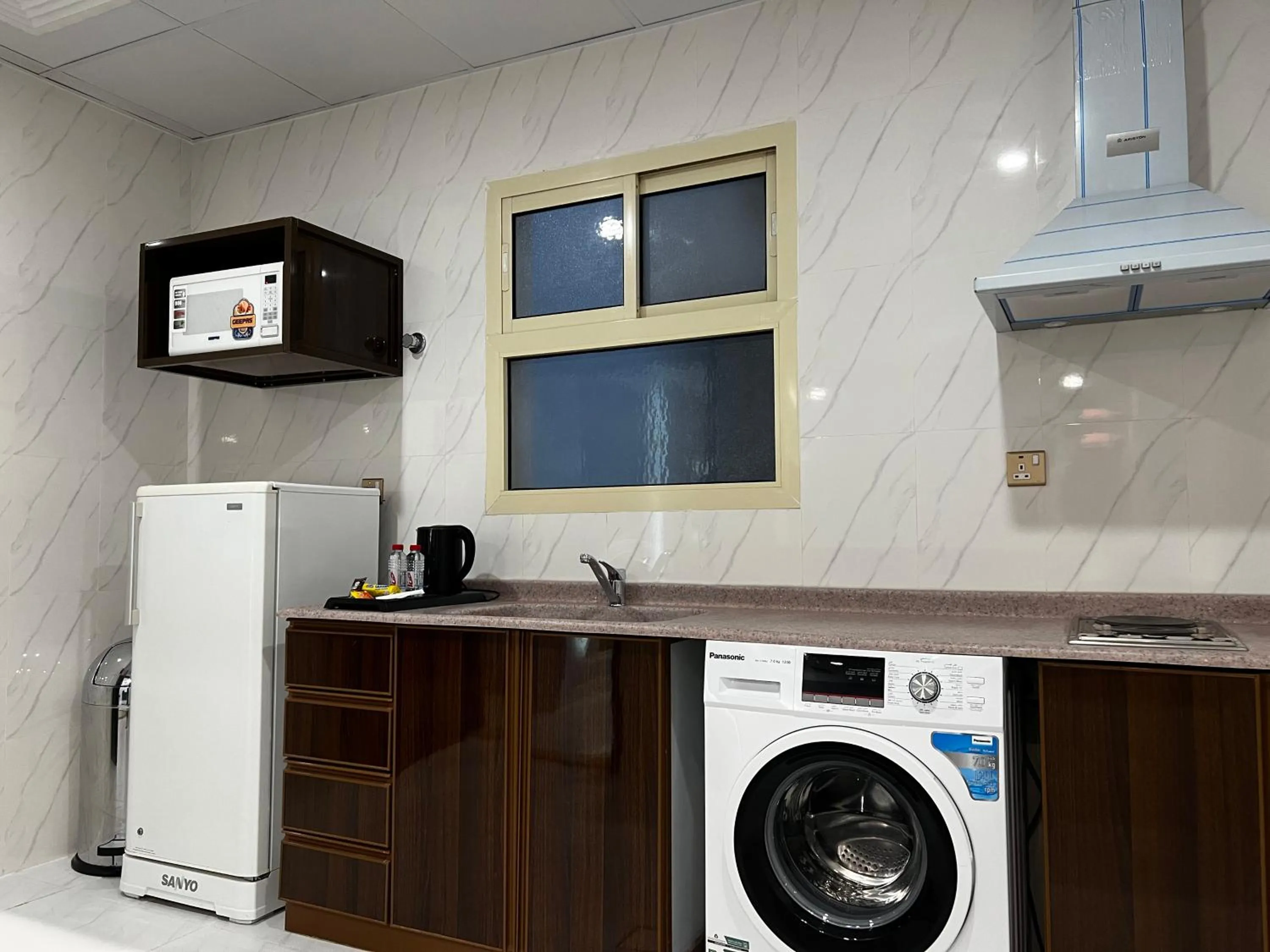 Kitchen or kitchenette in Travellerinn Serviced Apartment