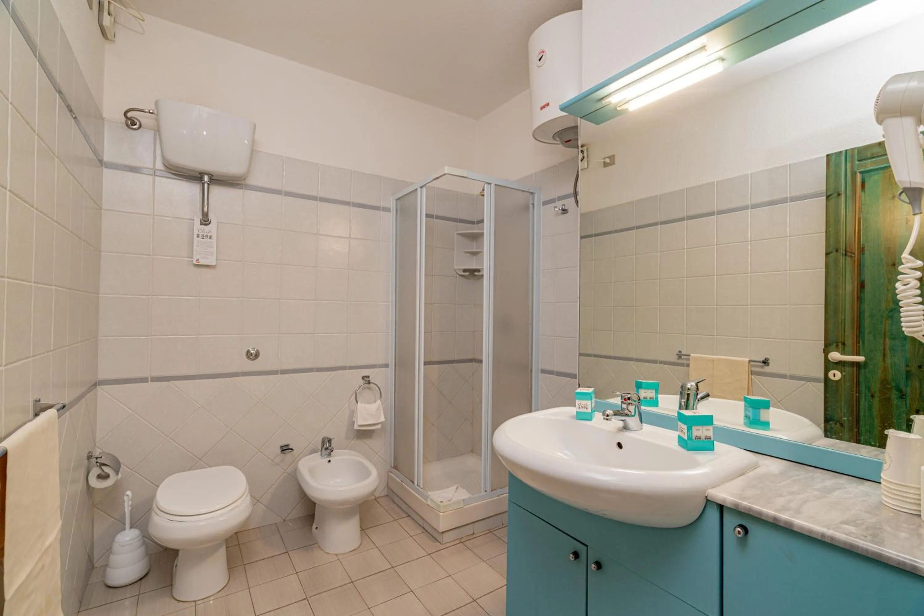 Bathroom in Club Esse Residence Capo D'orso