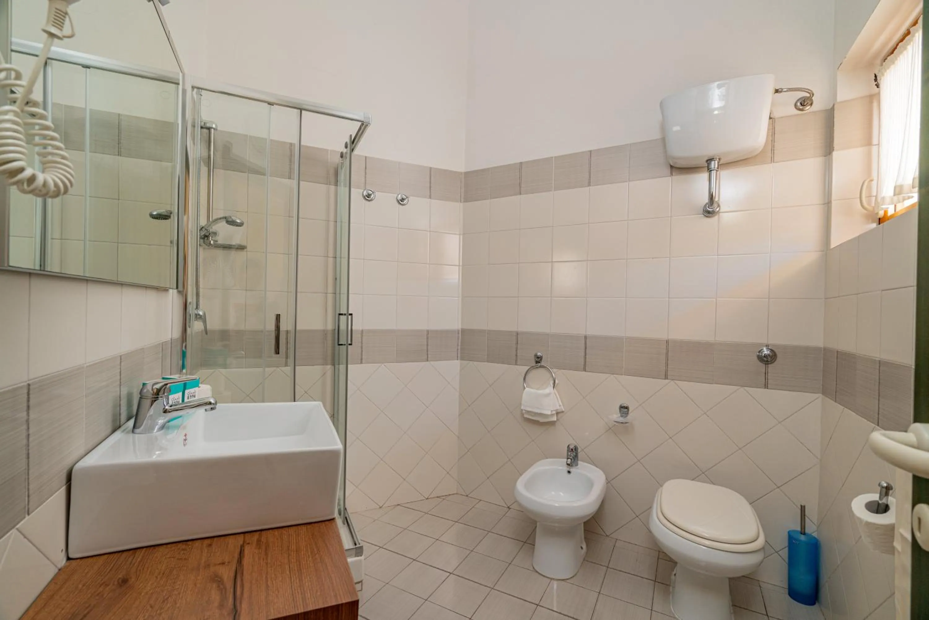 Bathroom in Club Esse Residence Capo D'orso