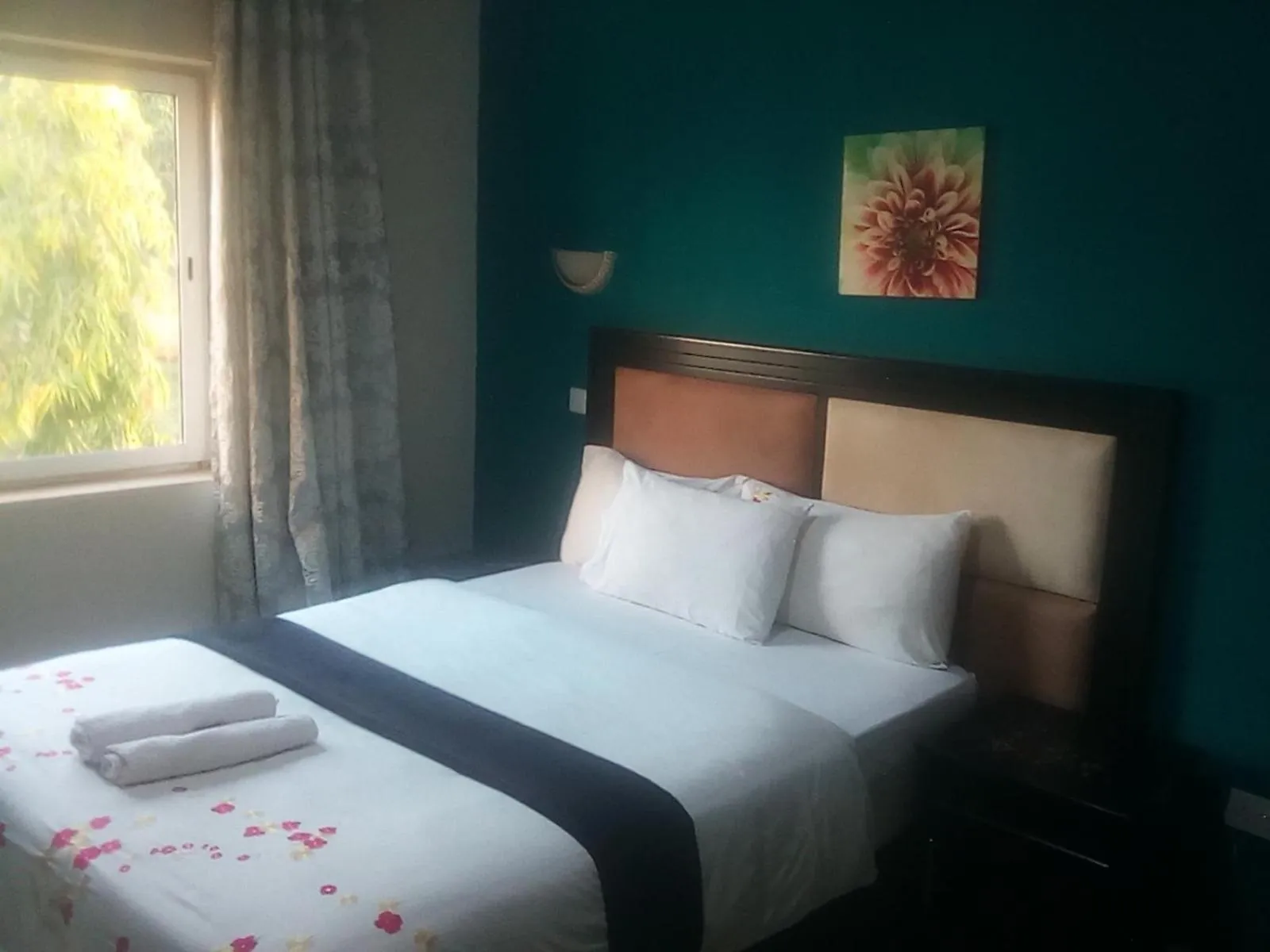 Bed in Royal Olympia Lodges and Safaris Livingstone