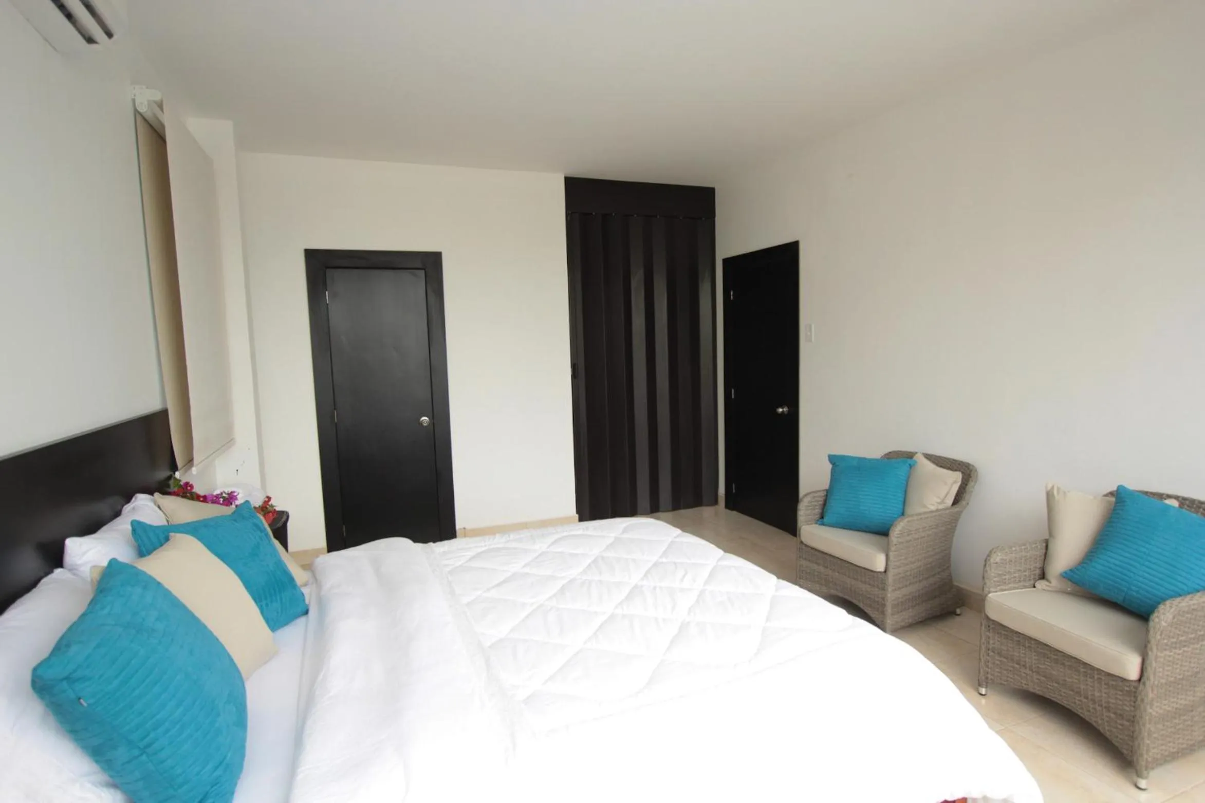 Photo of the whole room, Bed in Ocean Blue Hotel