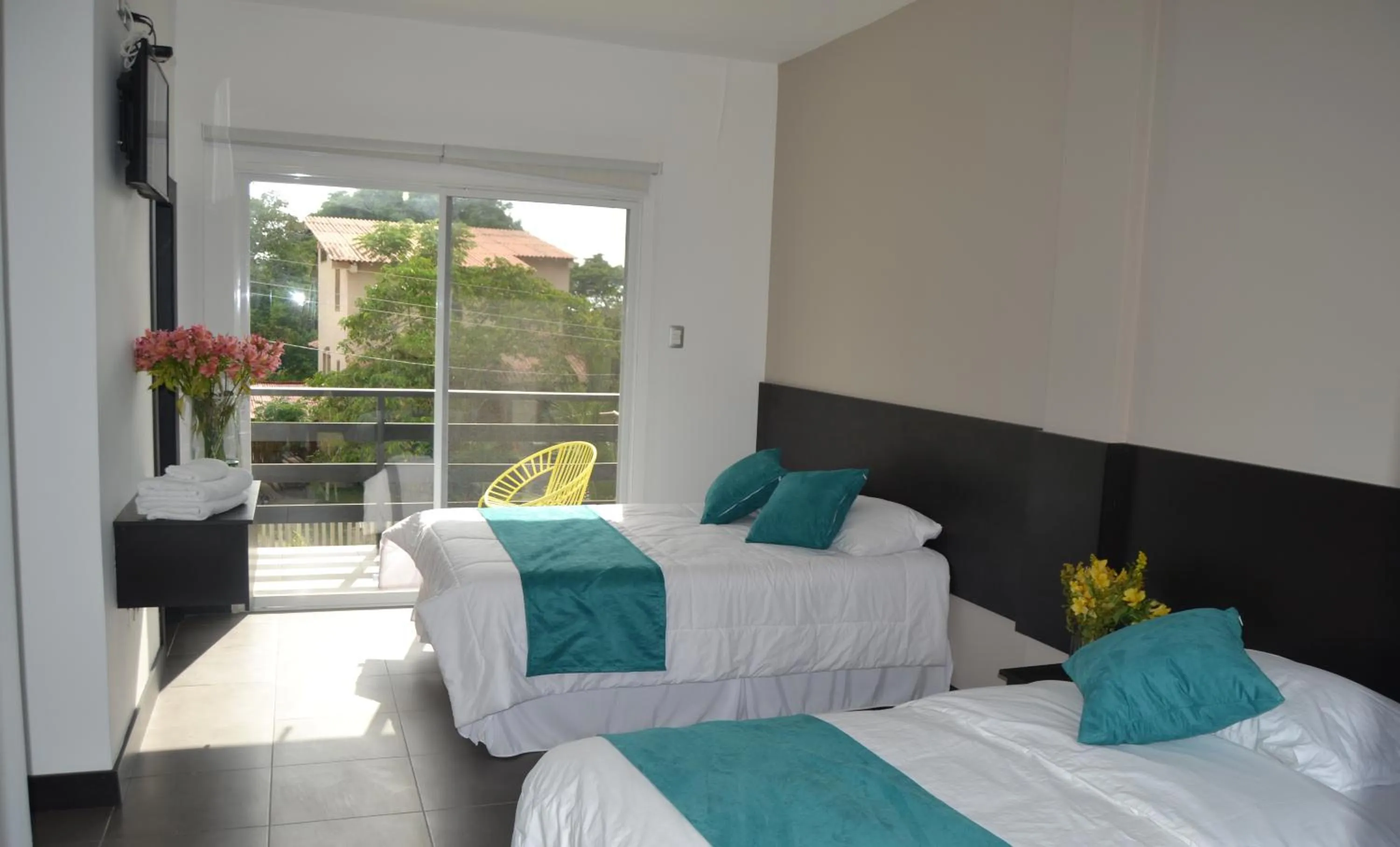 Photo of the whole room, Bed in Ocean Blue Hotel