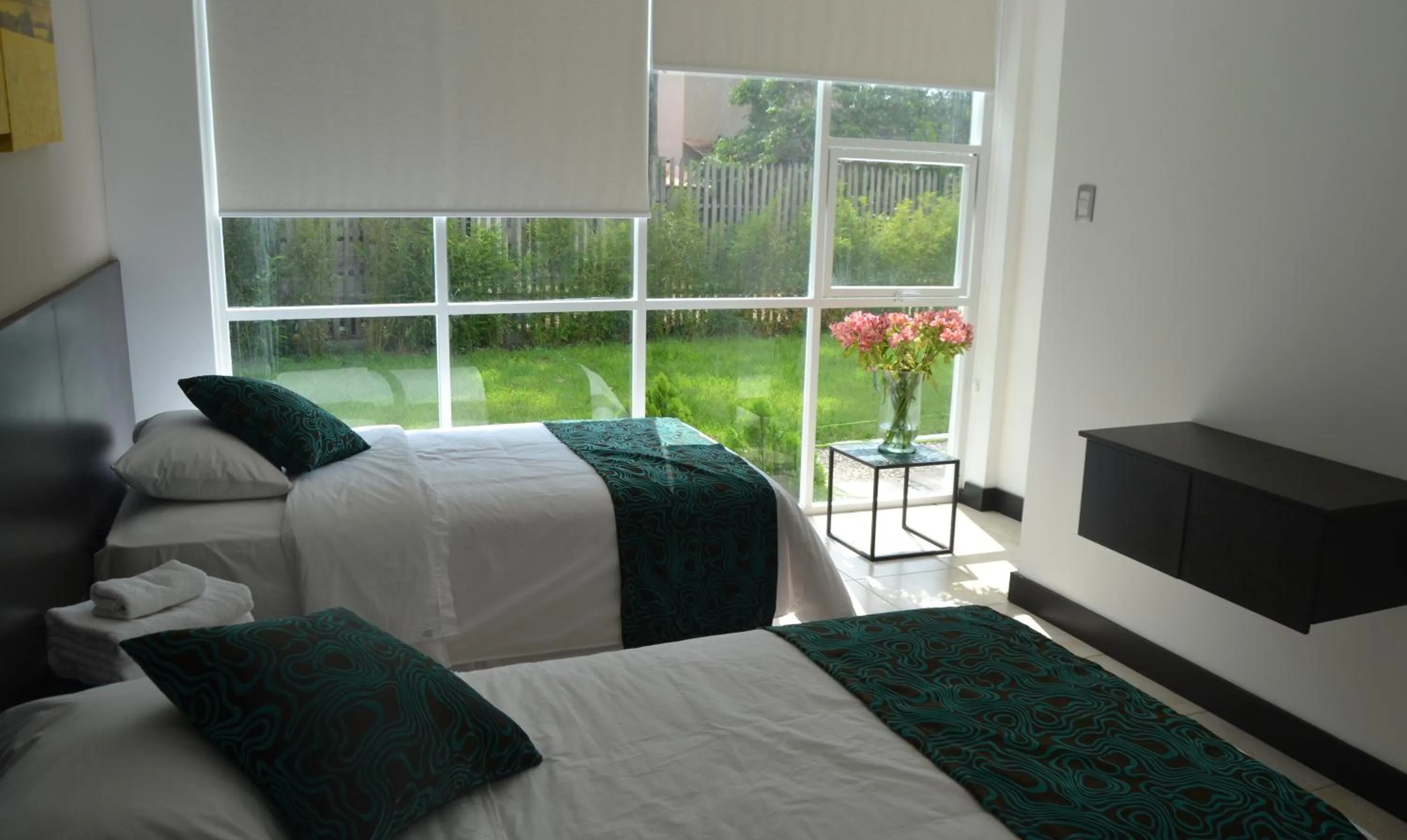 Photo of the whole room, Bed in Ocean Blue Hotel