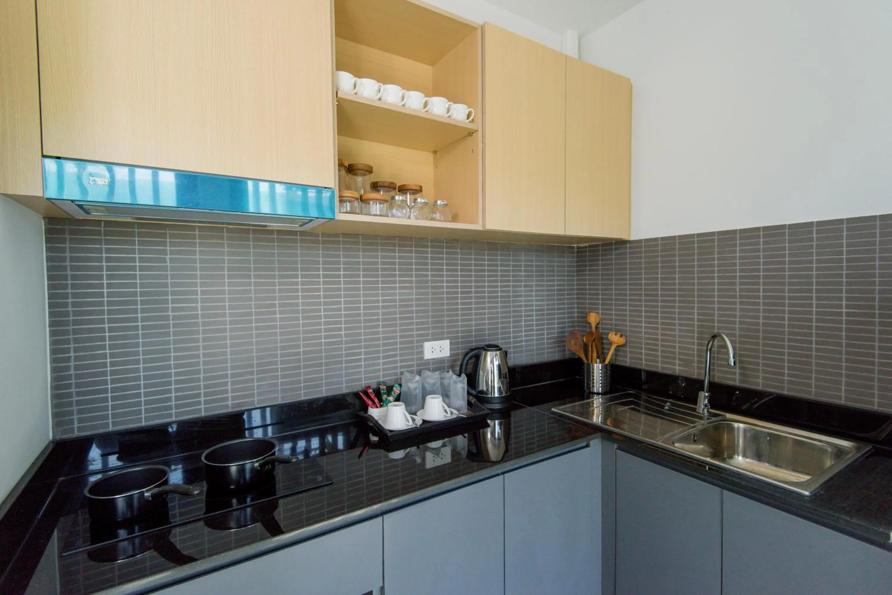 Communal kitchen in Hill Myna Condotel Official Account