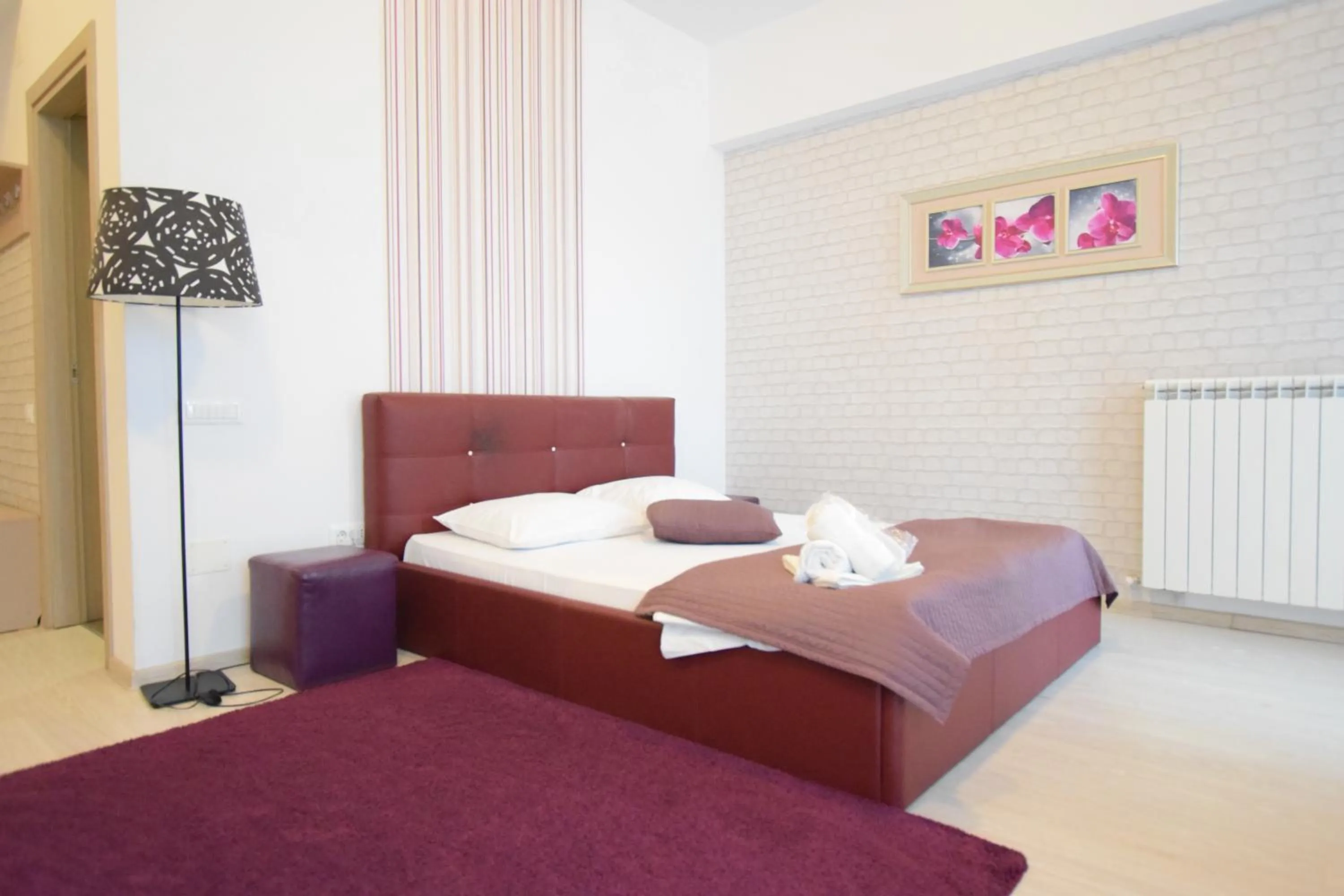 Bed in Uptown Residence Apartments