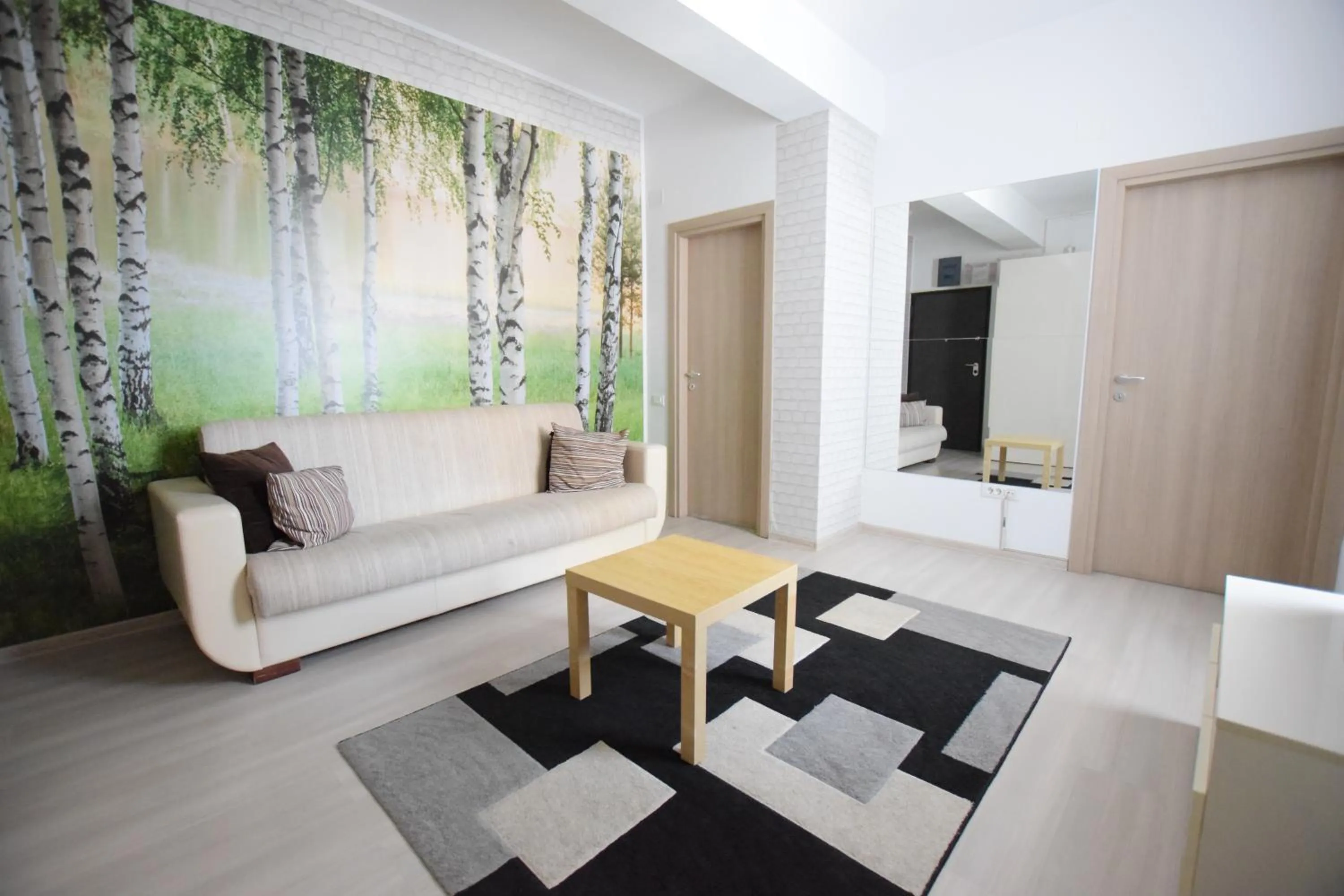 Living room, Bed in Uptown Residence Apartments