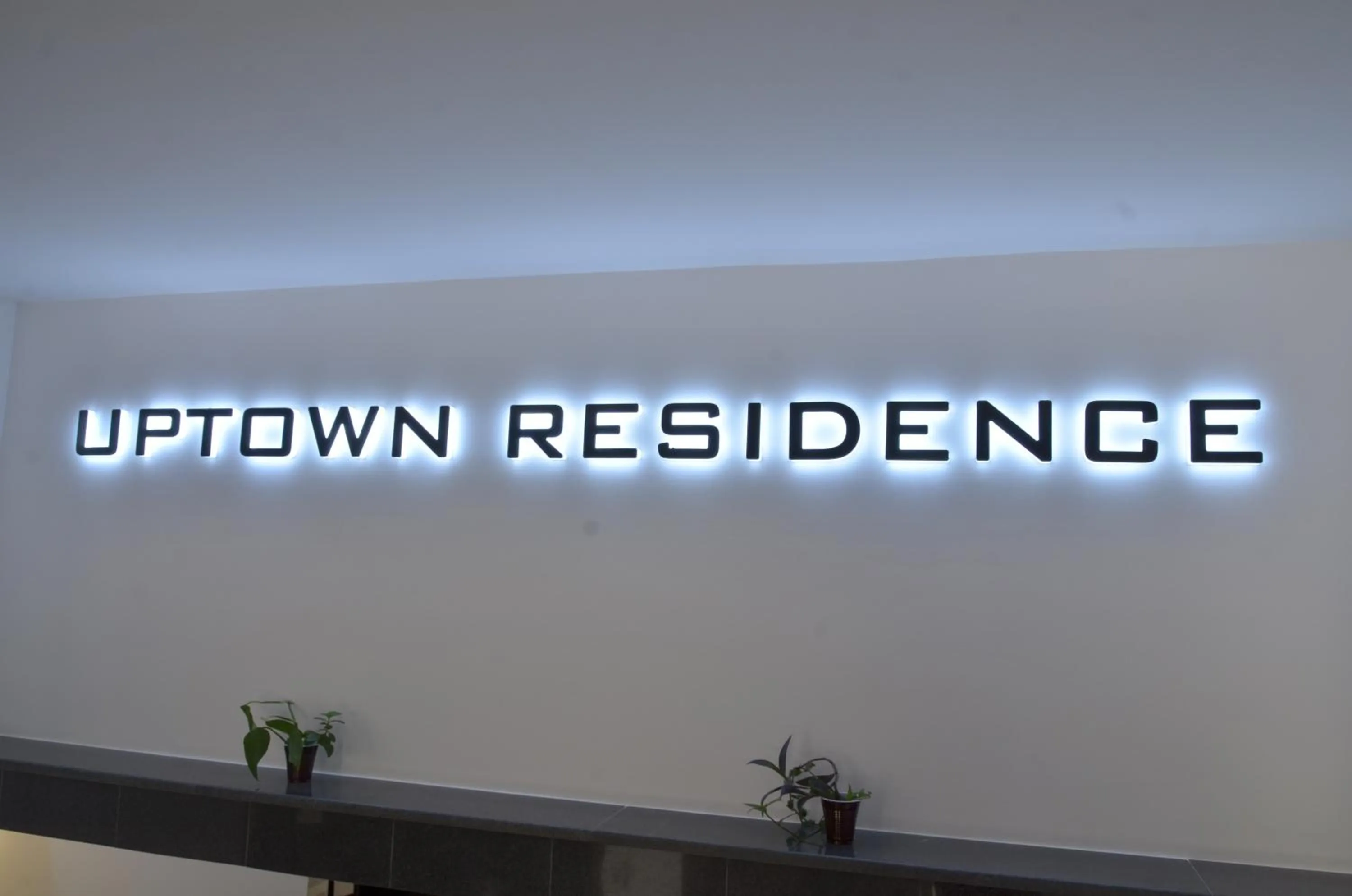 Property logo or sign in Uptown Residence Apartments