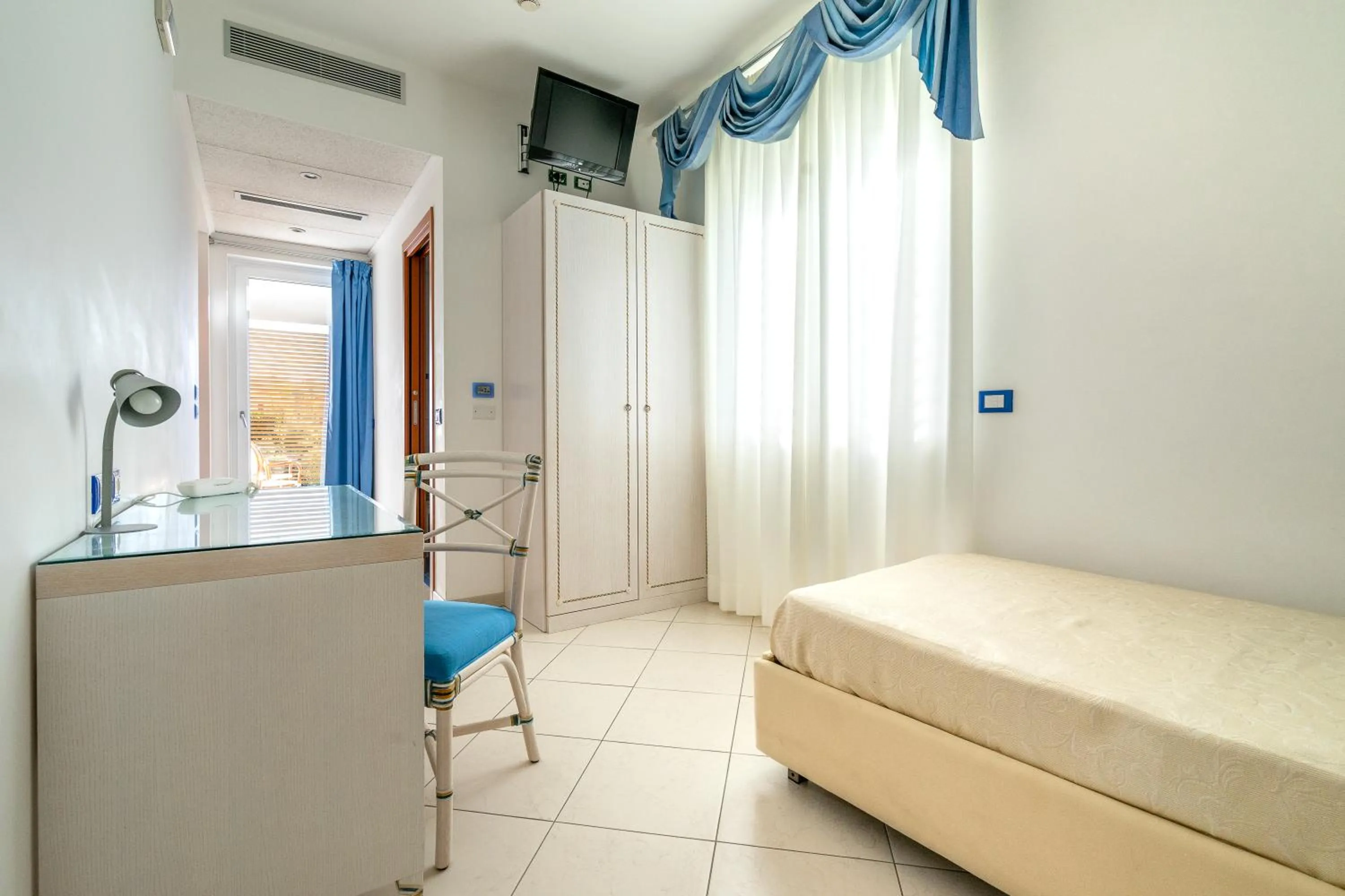 Bed in Elaia Garden Hotel